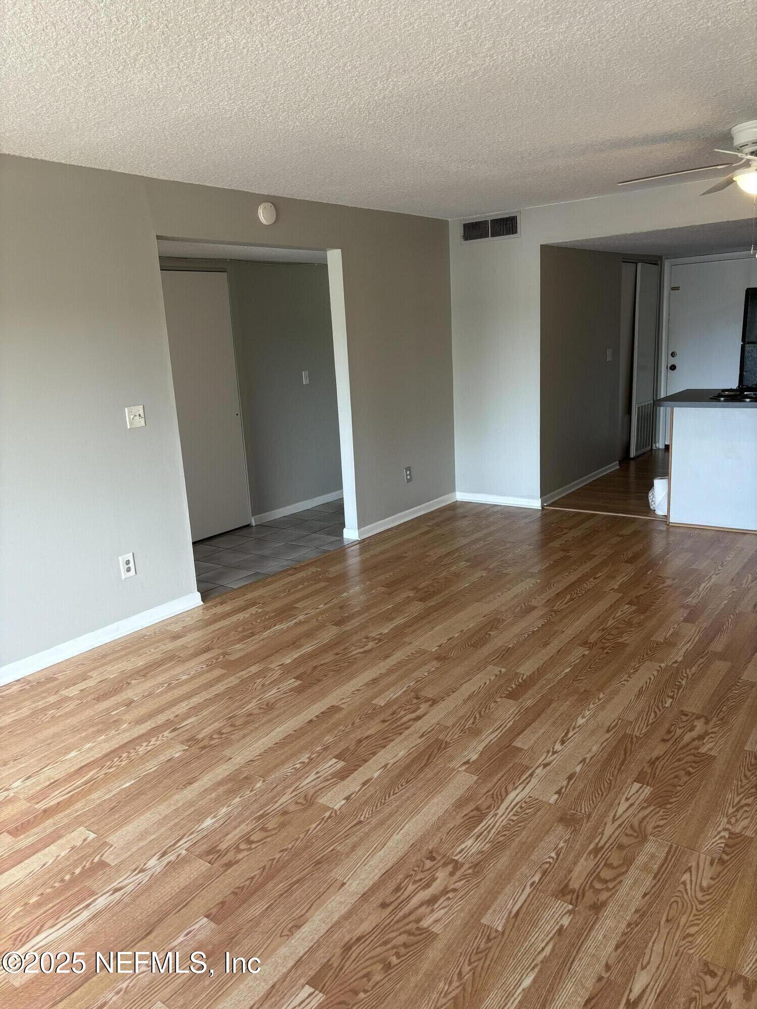 1000 3rd Street, Unit D Neptune Beach, FL 32266 - Photo 22 of 46 a view of an empty room with wooden floor