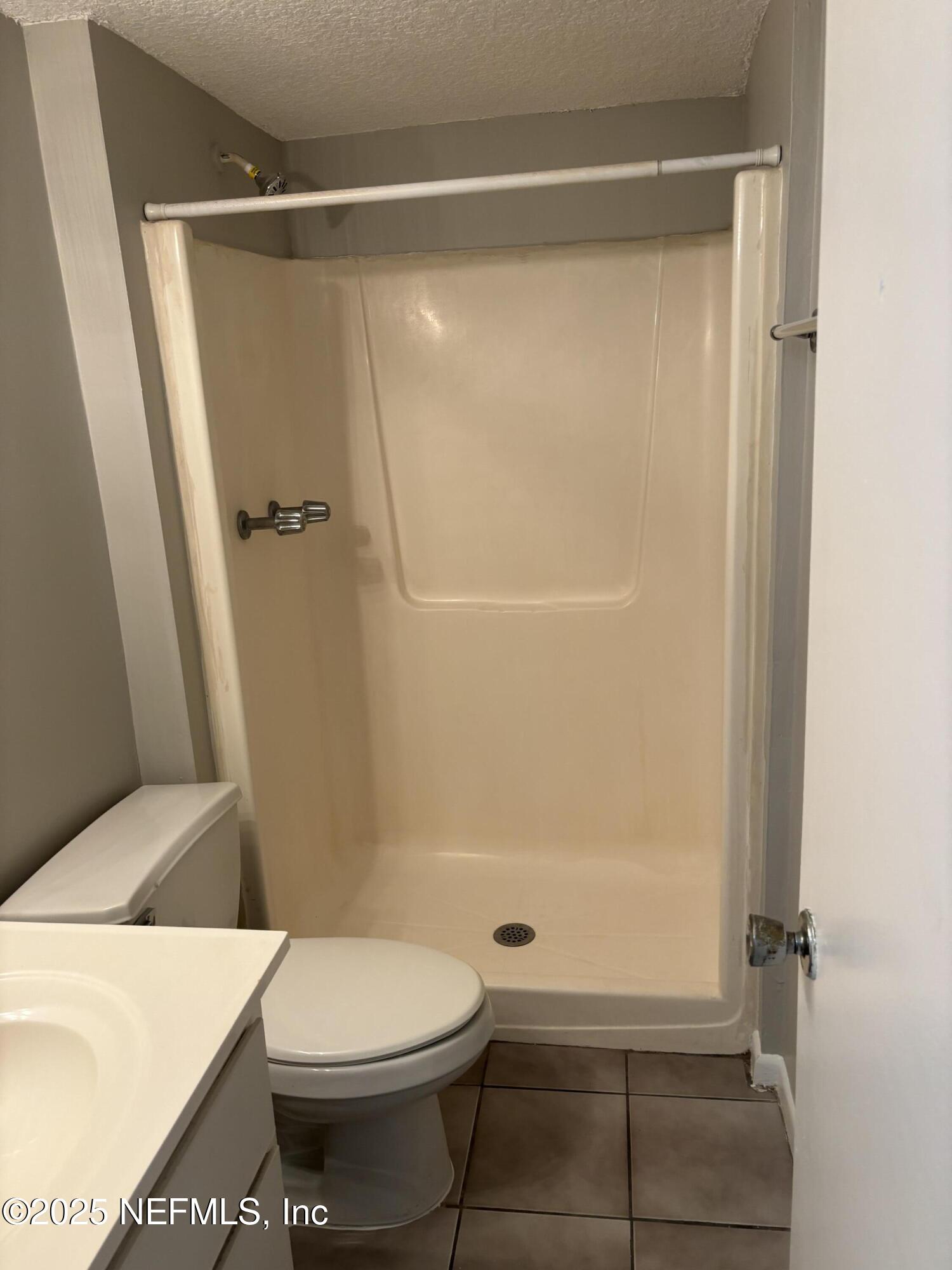 1000 3rd Street, Unit D Neptune Beach, FL 32266 - Photo 40 of 46 a bathroom with a toilet and a shower