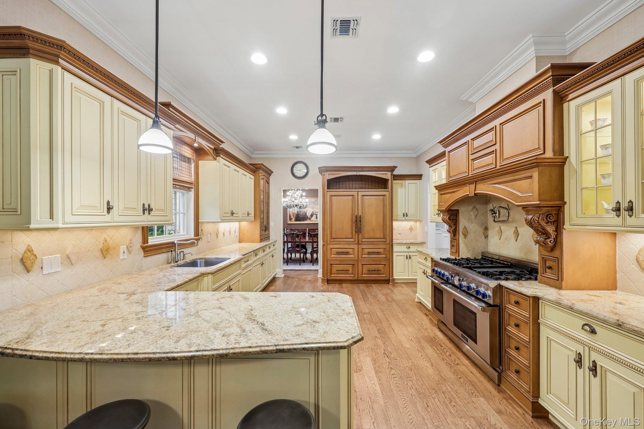 5 Mill Road Lloyd Harbor, NY 11743 - Photo 15 of 49 a kitchen with stainless steel appliances granite countertop a sink a stove and a wooden floors