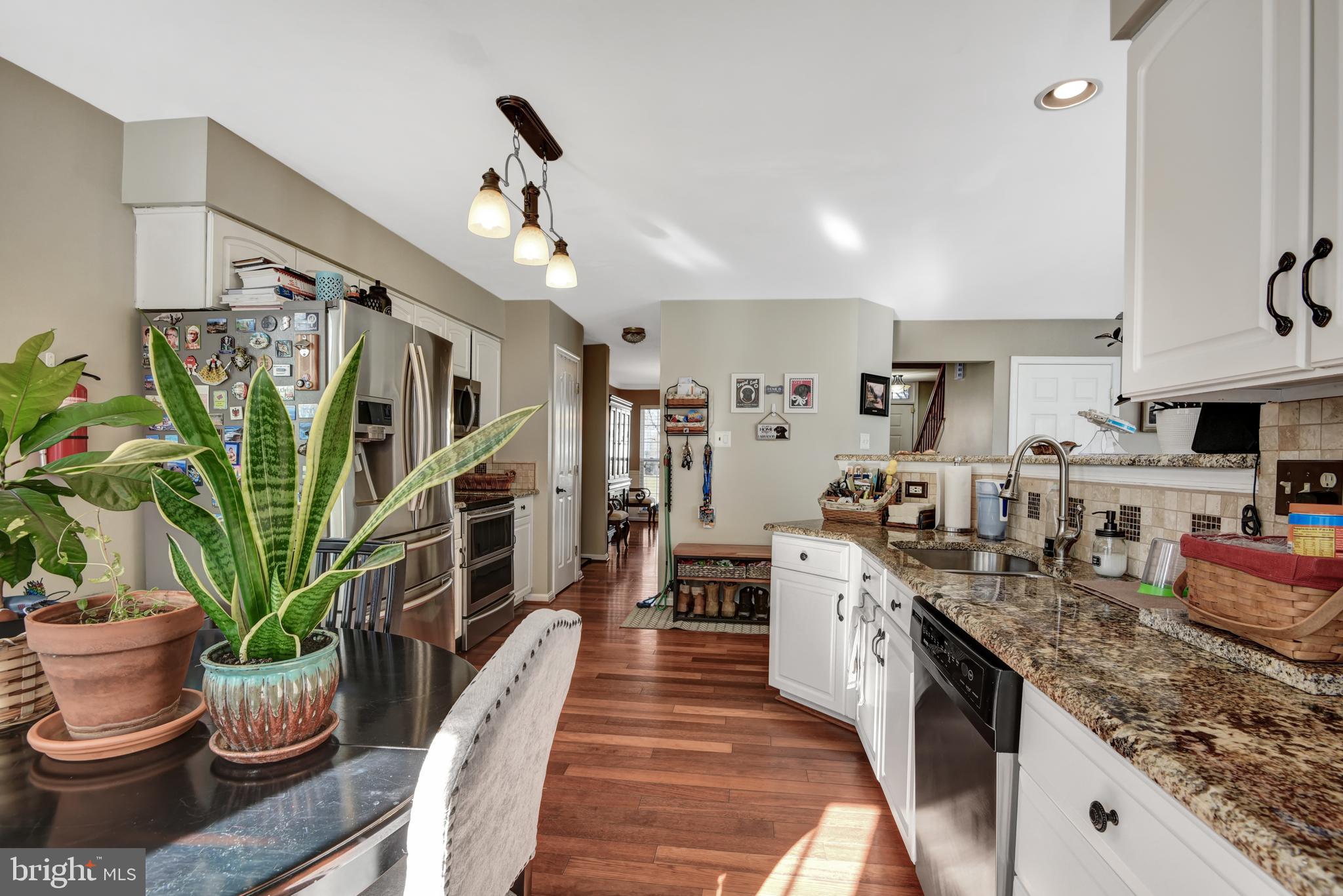 5944 Sandy Ridge Elkridge, MD 21075 - Photo 13 of 42 a large kitchen with lots of counter space a sink and cabinets