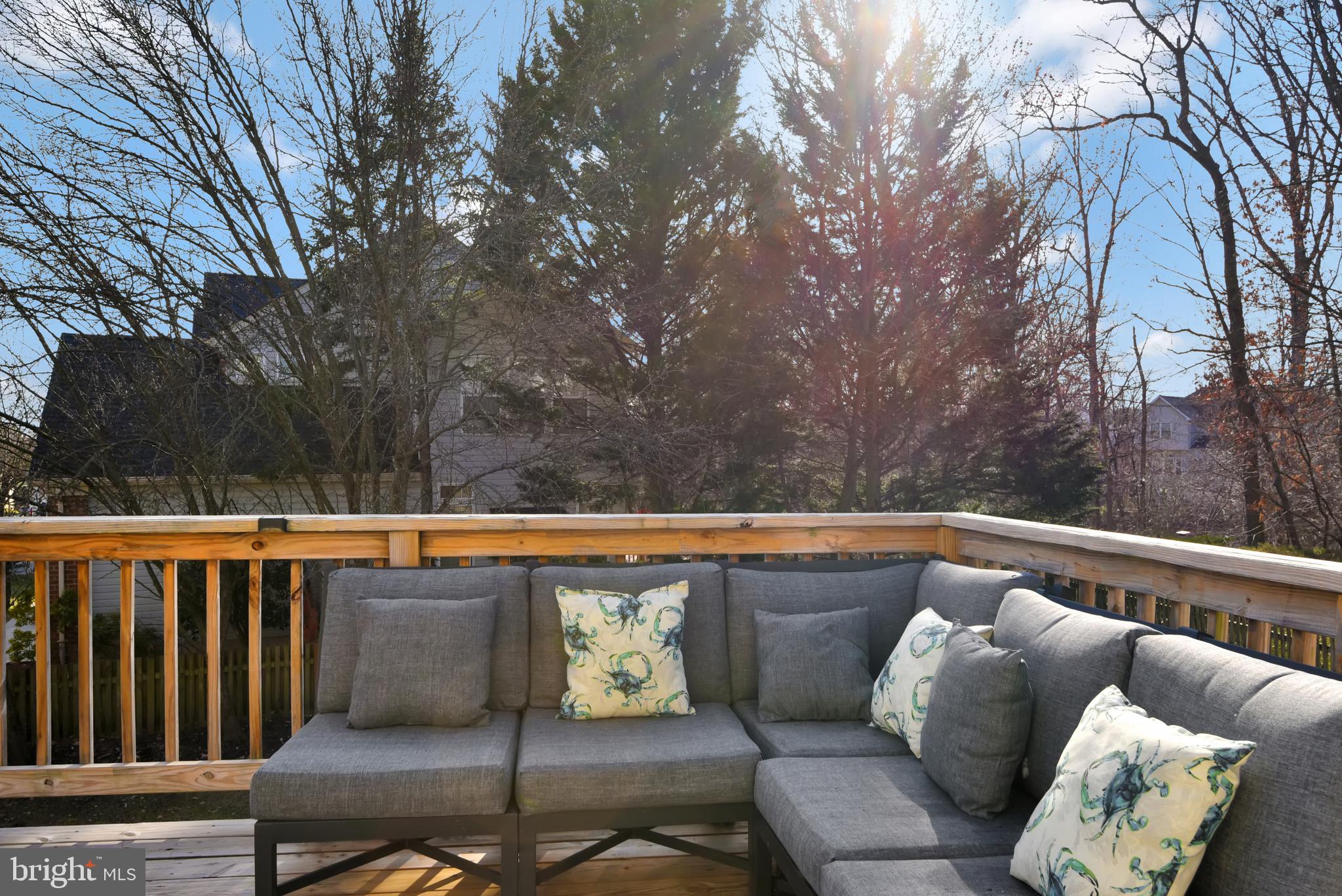 5944 Sandy Ridge Elkridge, MD 21075 - Photo 15 of 42 a roof deck with couches and wooden fence