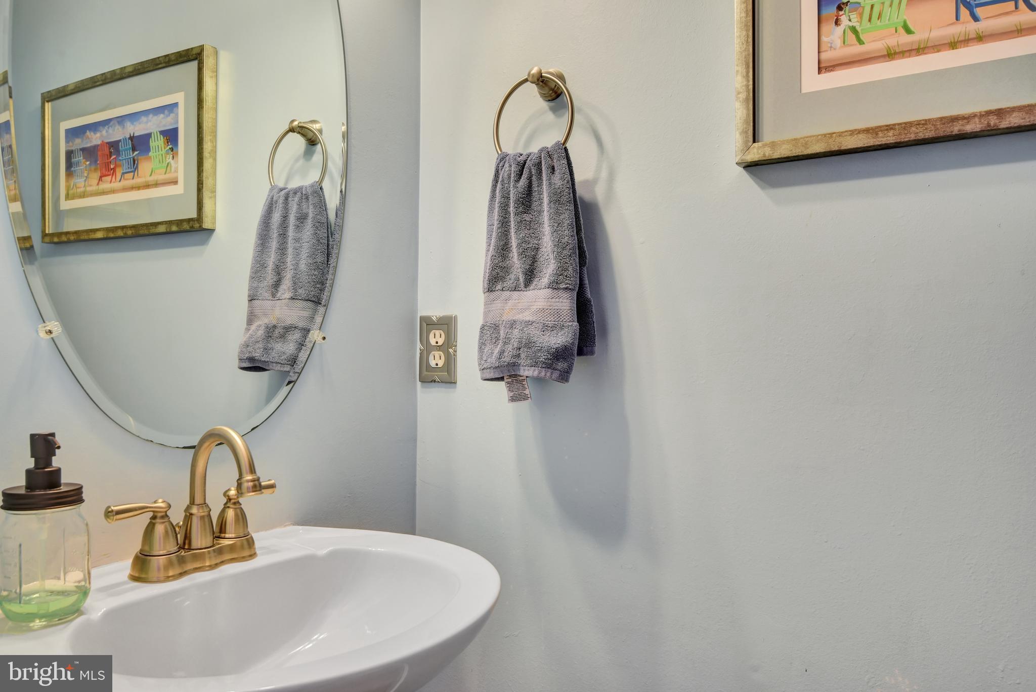 5944 Sandy Ridge Elkridge, MD 21075 - Photo 18 of 42 a bathroom with a sink and a mirror