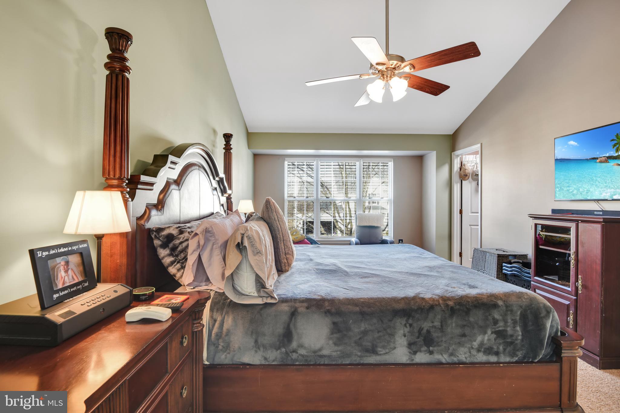 5944 Sandy Ridge Elkridge, MD 21075 - Photo 21 of 42 a bed sitting in a room next to a window