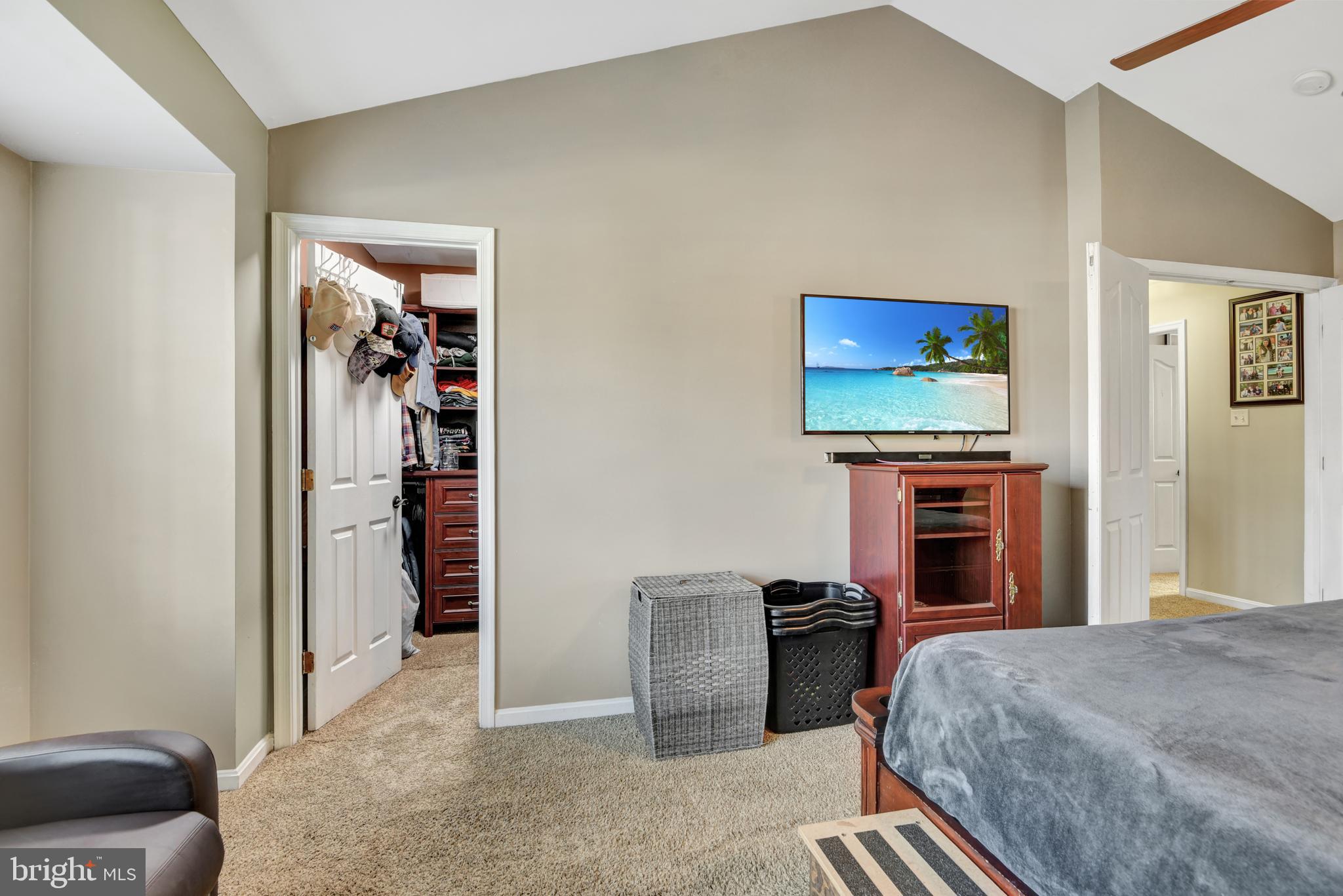 5944 Sandy Ridge Elkridge, MD 21075 - Photo 22 of 42 a bedroom with furniture and a flat screen tv