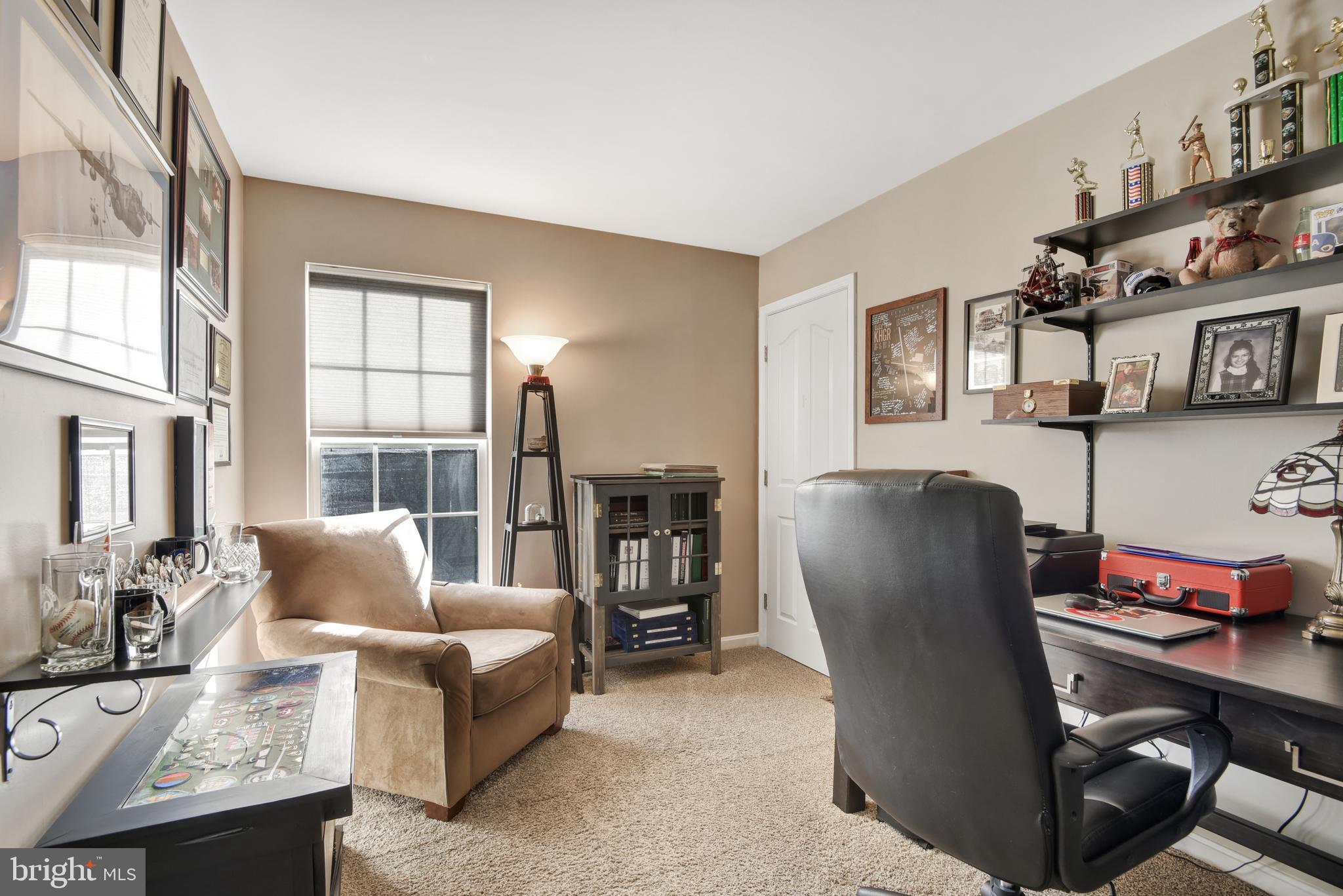 5944 Sandy Ridge Elkridge, MD 21075 - Photo 27 of 42 a living room with furniture and a fireplace