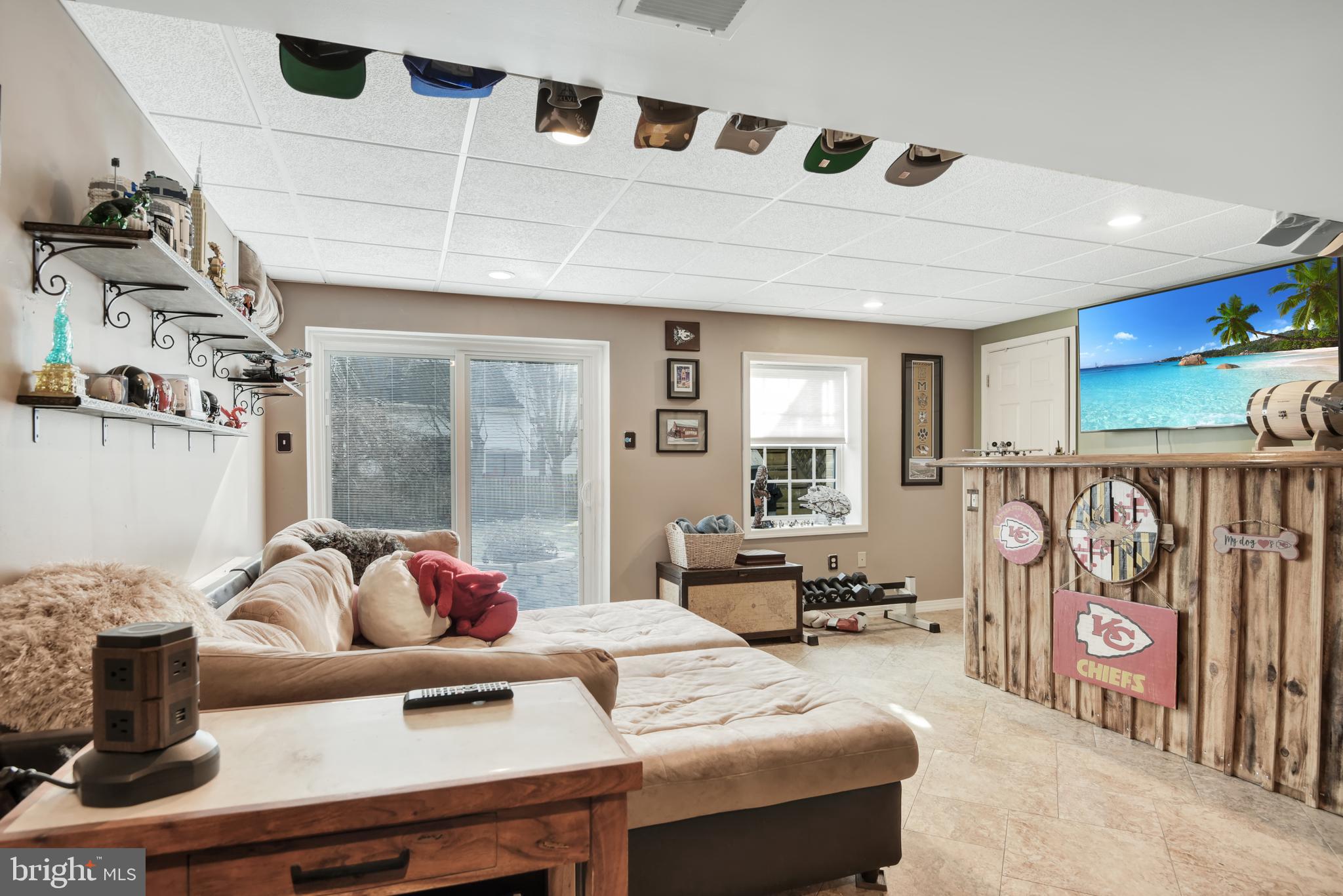5944 Sandy Ridge Elkridge, MD 21075 - Photo 30 of 42 a living room with furniture and a flat screen tv