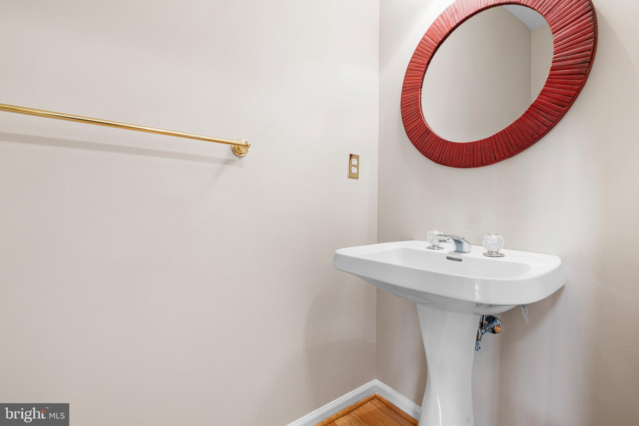 8 Arizona State Drive Newark, DE 19713 - Photo 17 of 32 a bathroom with a sink and a mirror
