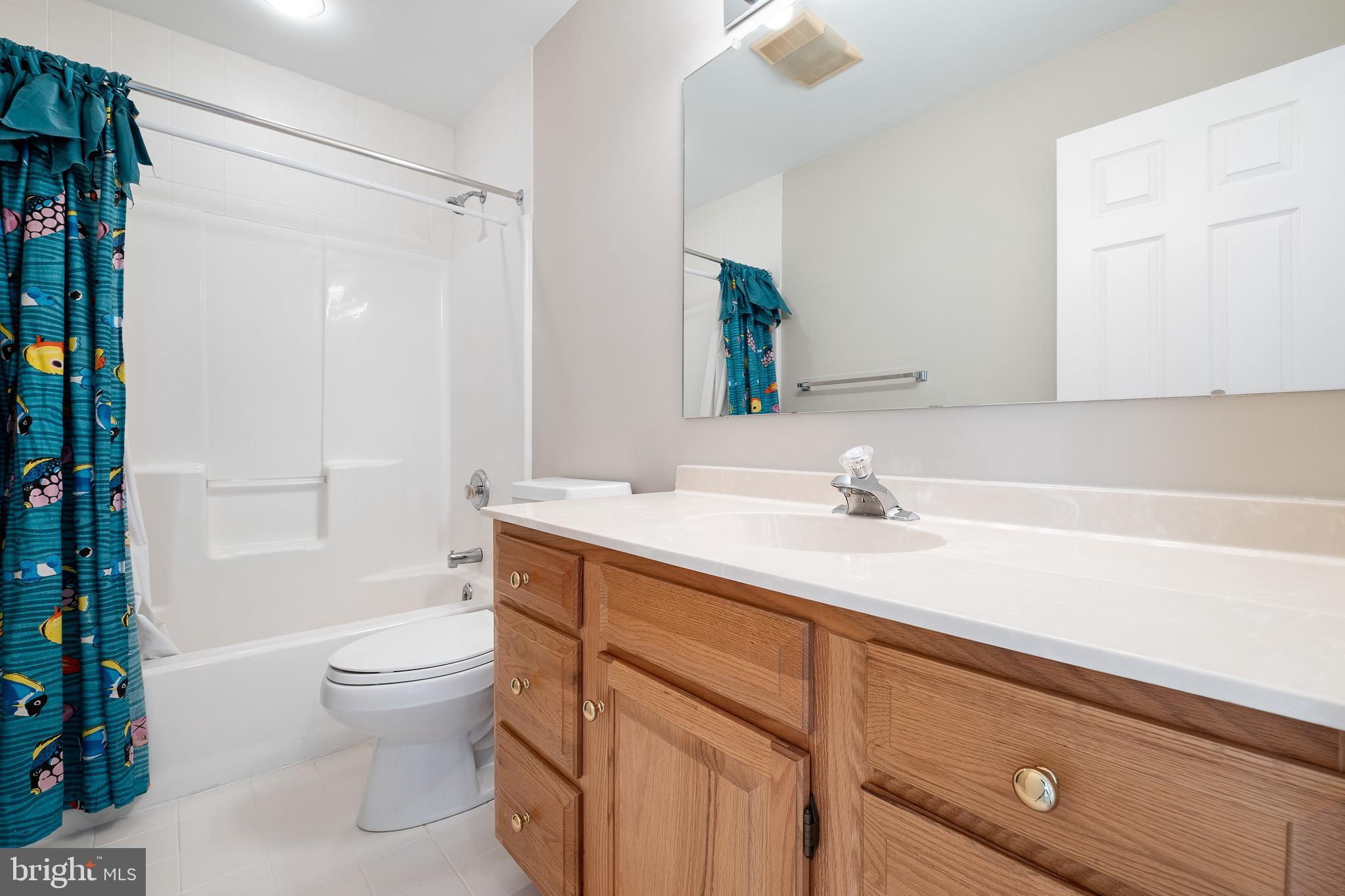 8 Arizona State Drive Newark, DE 19713 - Photo 24 of 32 a bathroom with a sink a toilet and shower