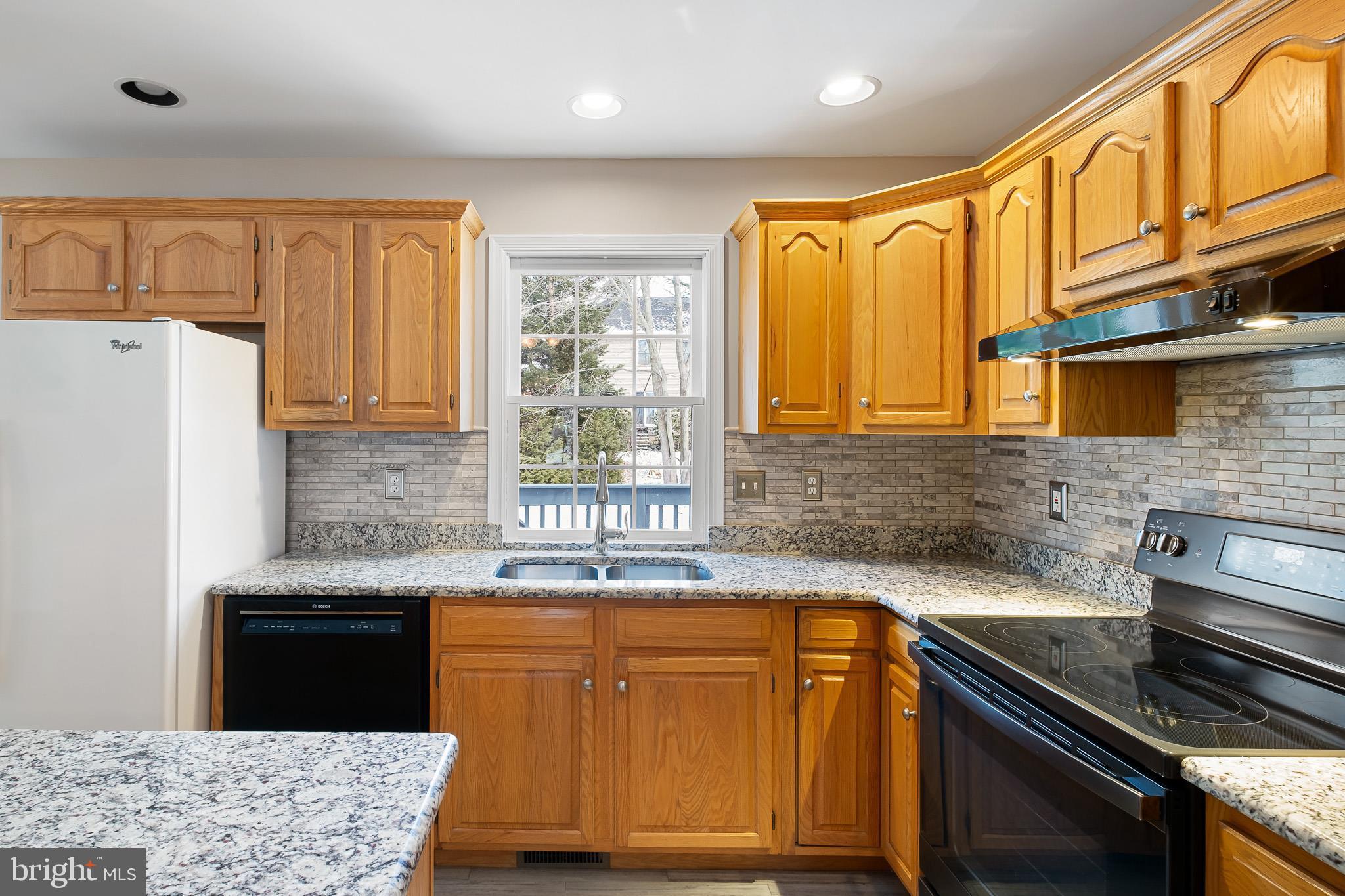 8 Arizona State Drive Newark, DE 19713 - Photo 8 of 32 a kitchen with stainless steel appliances granite countertop a sink stove and refrigerator