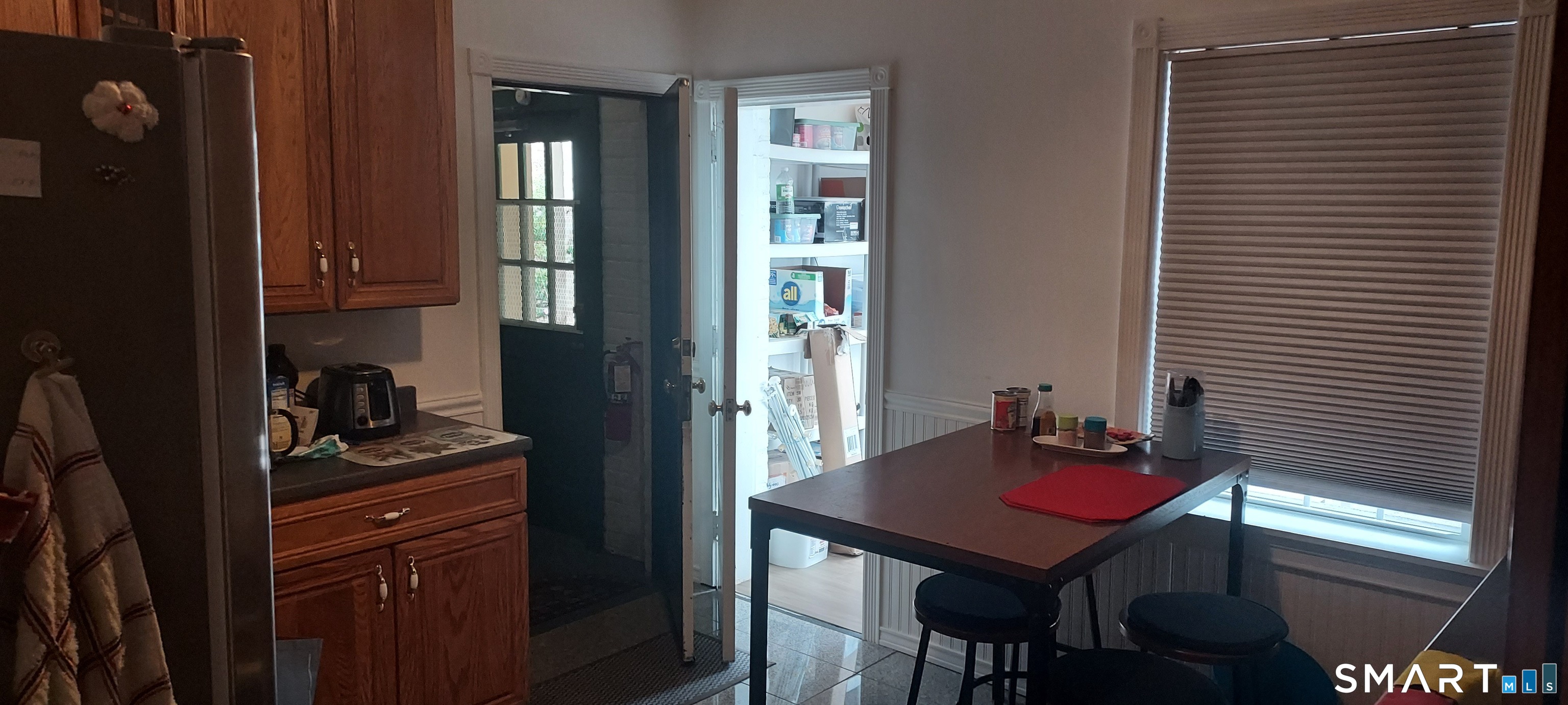 580 Wilmot Avenue, Unit 2 Bridgeport, CT 06607 - Photo 3 of 10 a view of a kitchen area with furniture and window