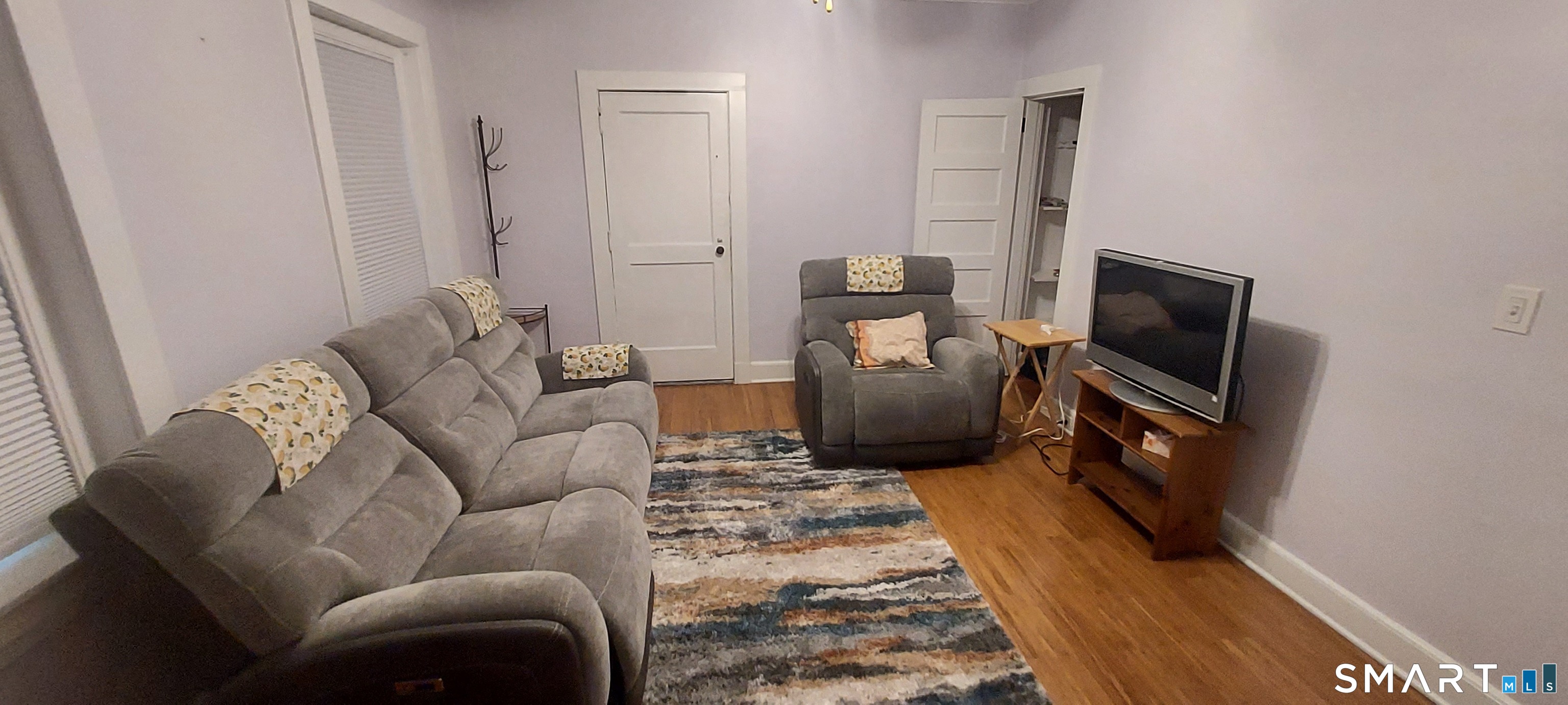 580 Wilmot Avenue, Unit 2 Bridgeport, CT 06607 - Photo 7 of 10 a living room with furniture and a flat screen tv