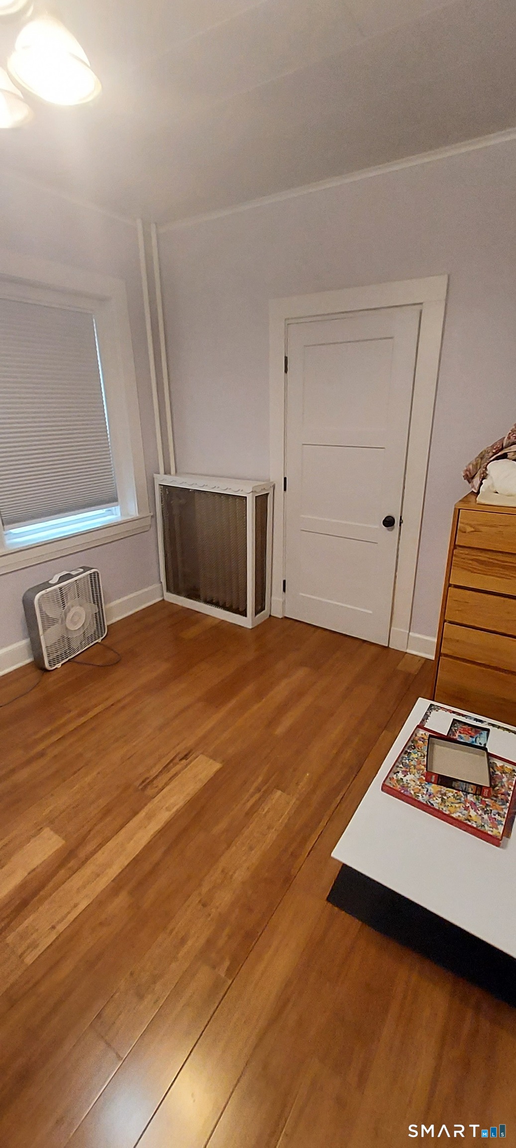 580 Wilmot Avenue, Unit 2 Bridgeport, CT 06607 - Photo 9 of 10 a bedroom with a bed and a window