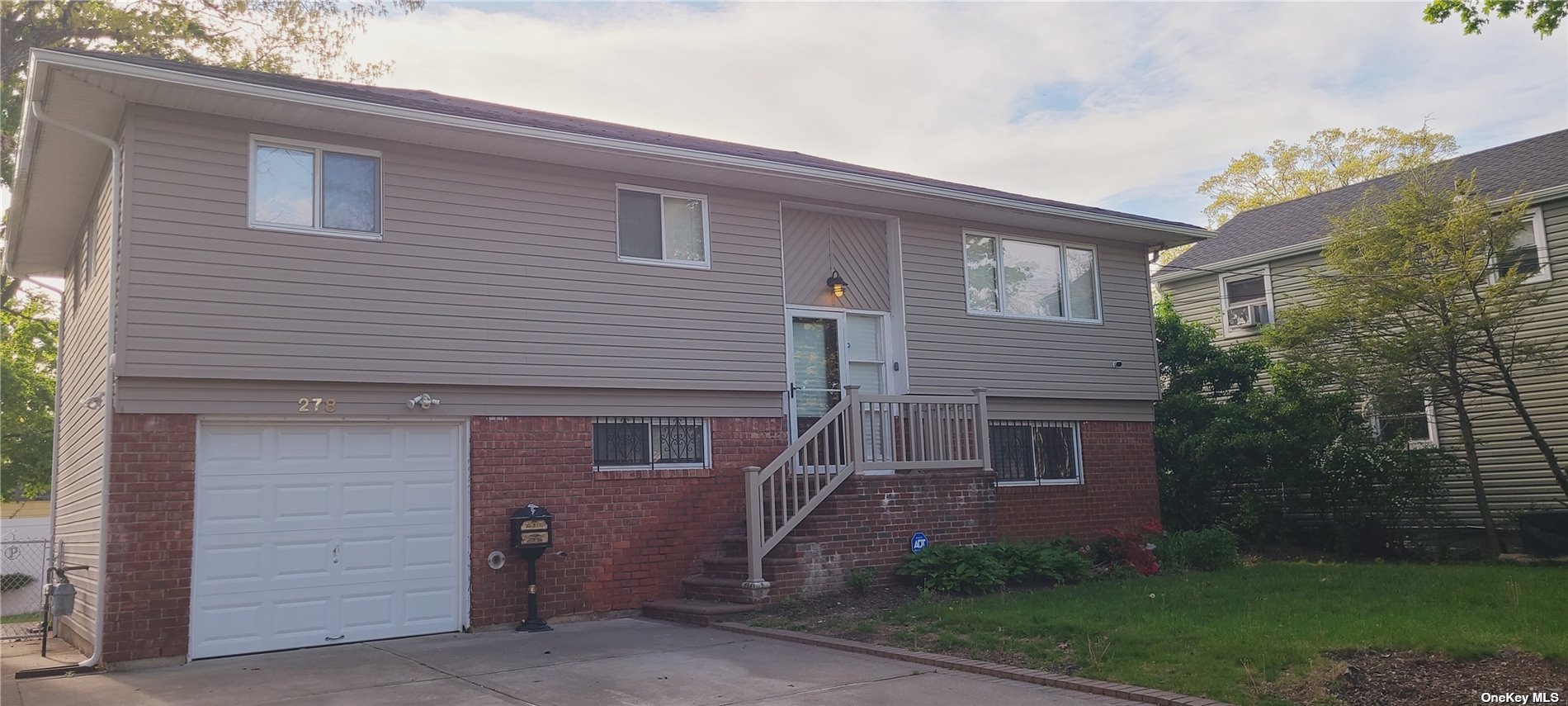 278 Long Beach Road Hempstead, NY 11550 - Photo 1 of 1 a front view of a house with garden