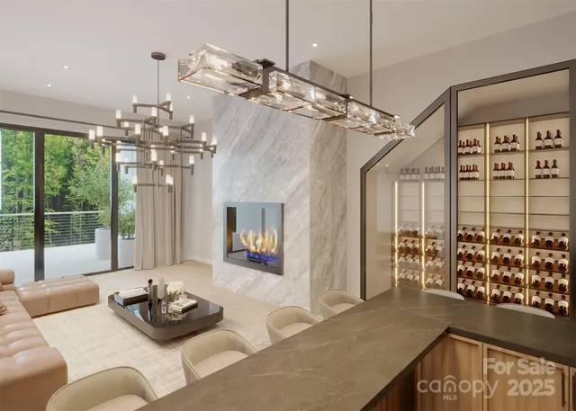 a living room with furniture and a chandelier