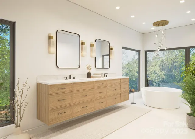a bathroom with a double vanity sink mirror and bathtub