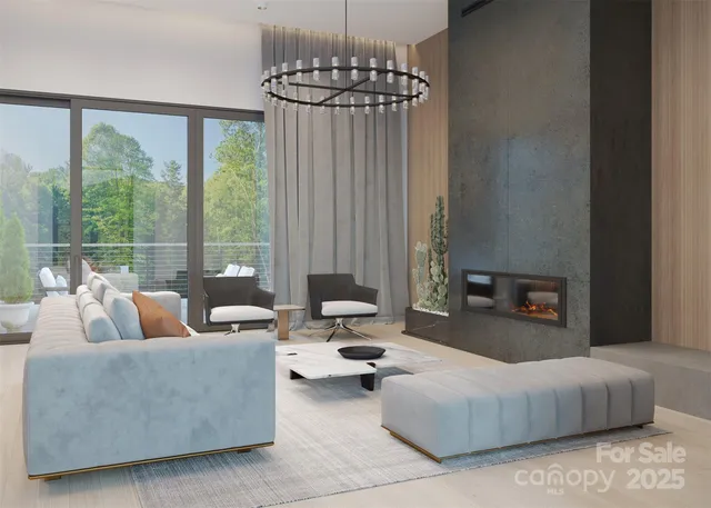 a living room with furniture and a chandelier