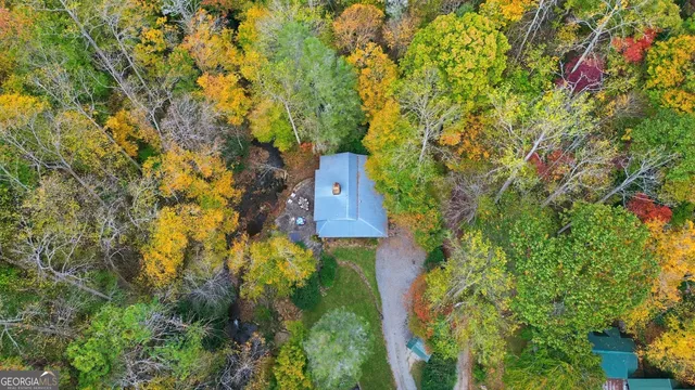 a aerial view of a house with a yard