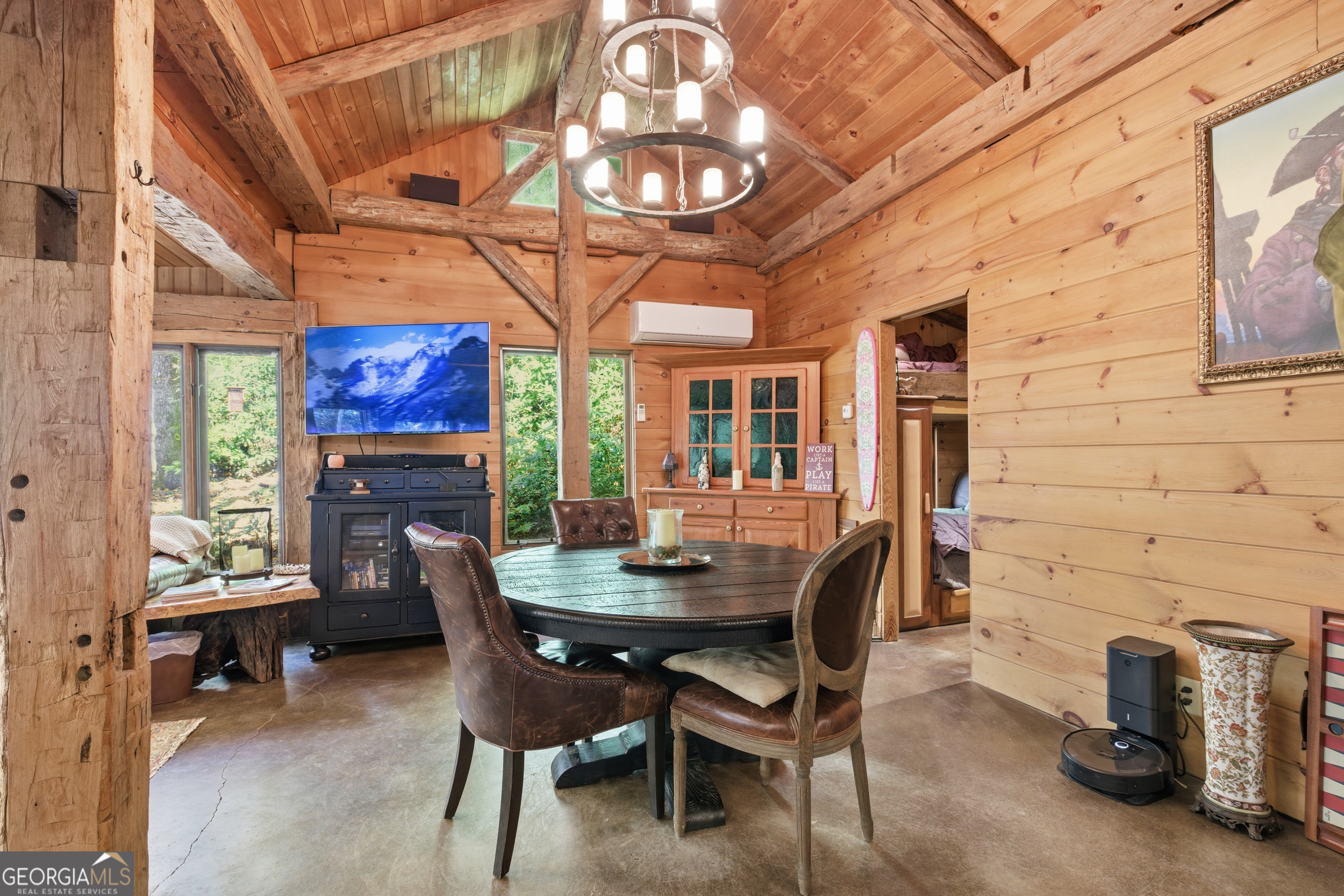 2965 Tate City Road Hayesville, NC 28904 - Photo 23 of 49 a dining room with furniture a rug and a chandelier
