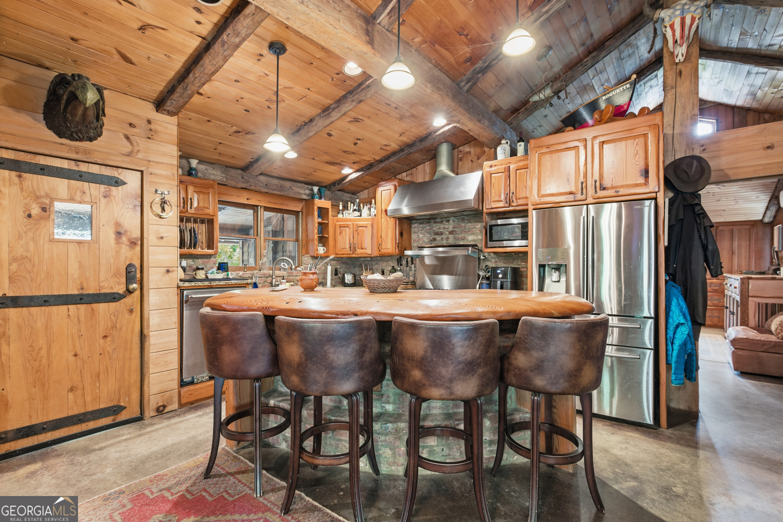 2965 Tate City Road Hayesville, NC 28904 - Photo 27 of 49 a dining table with chairs and washer