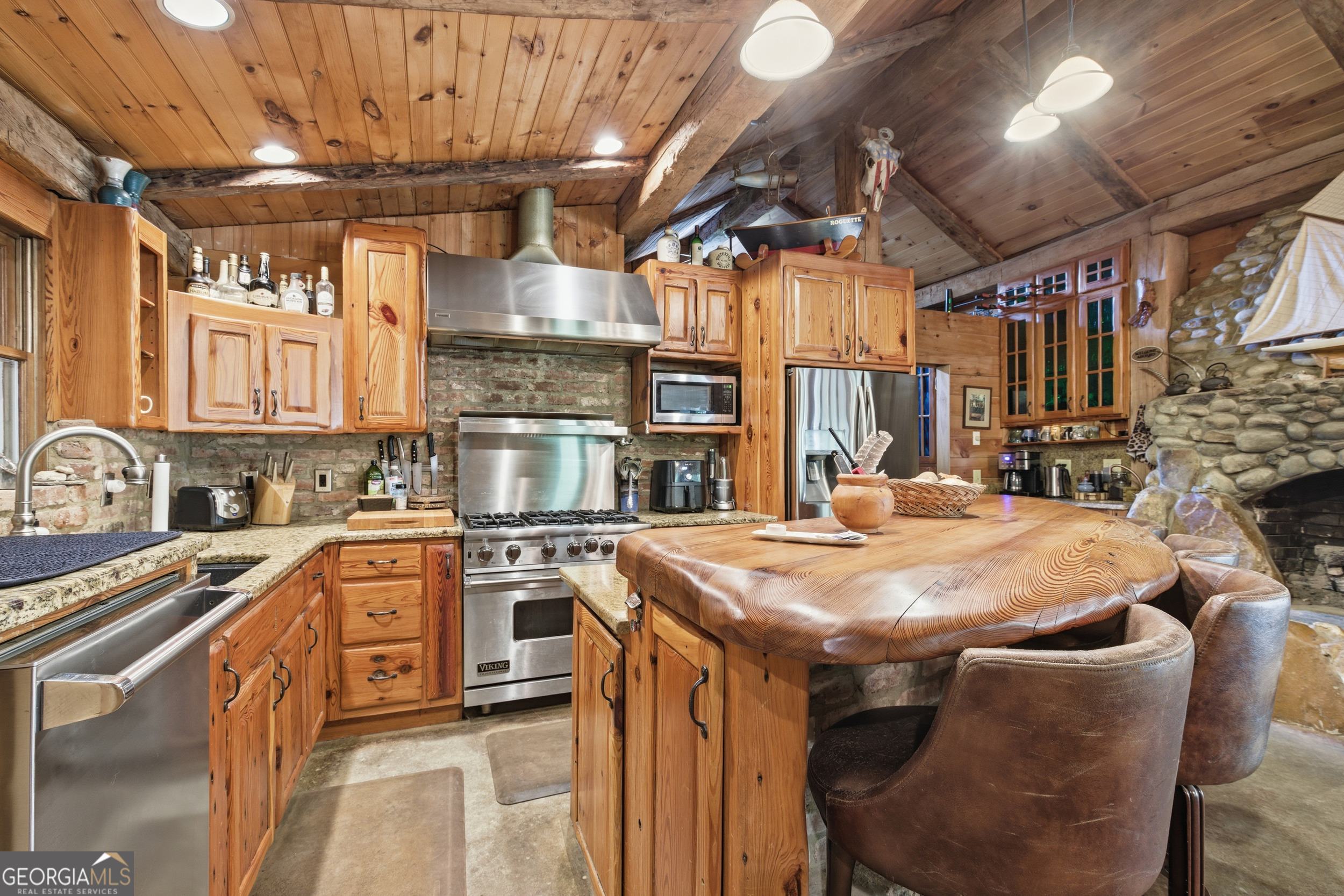 2965 Tate City Road Hayesville, NC 28904 - Photo 28 of 49 a kitchen with stainless steel appliances granite countertop a sink a stove and a refrigerator