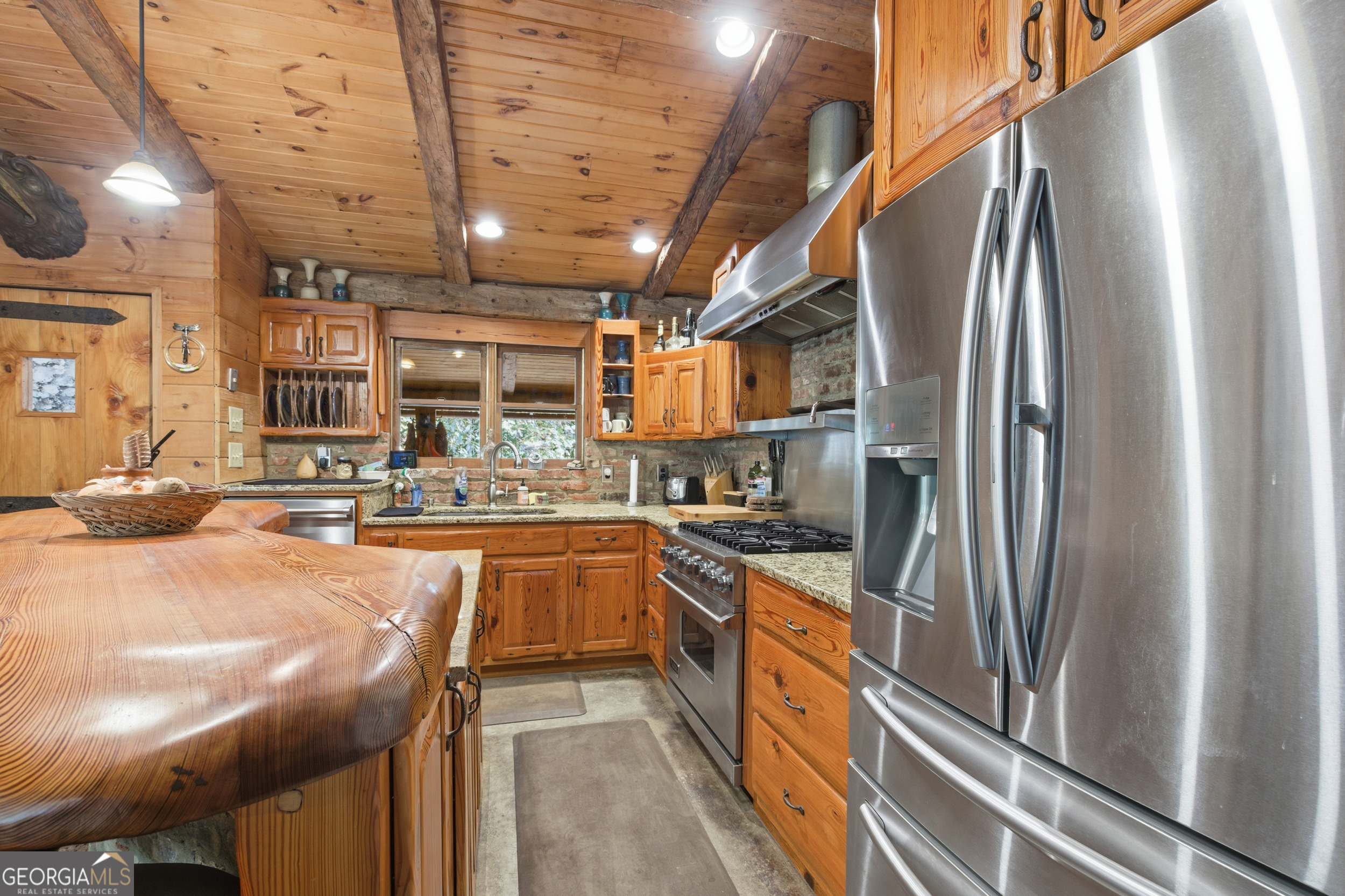 2965 Tate City Road Hayesville, NC 28904 - Photo 29 of 49 a kitchen with stainless steel appliances granite countertop a sink a stove and a refrigerator
