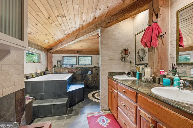 a bathroom with a sink a vanity and mirror
