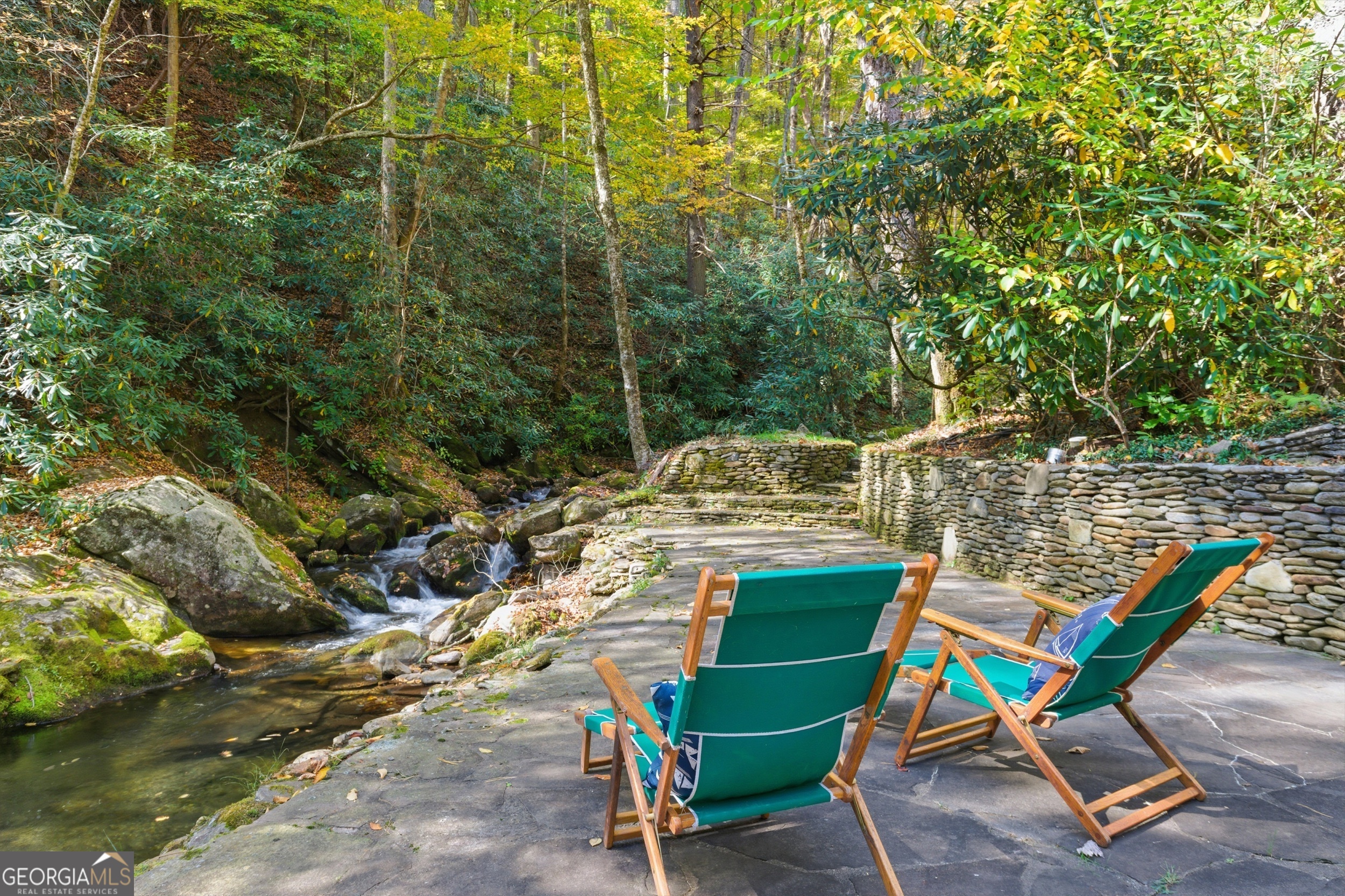 2965 Tate City Road Hayesville, NC 28904 - Photo 7 of 49 a view of a chairs and table in a backyard