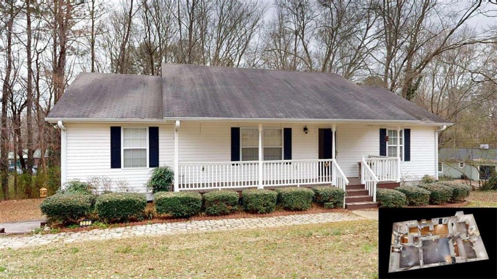 257 Old Acworth Road Dallas, GA 30132 - Photo 1 of 1 a front view of a house with a yard and outdoor seating