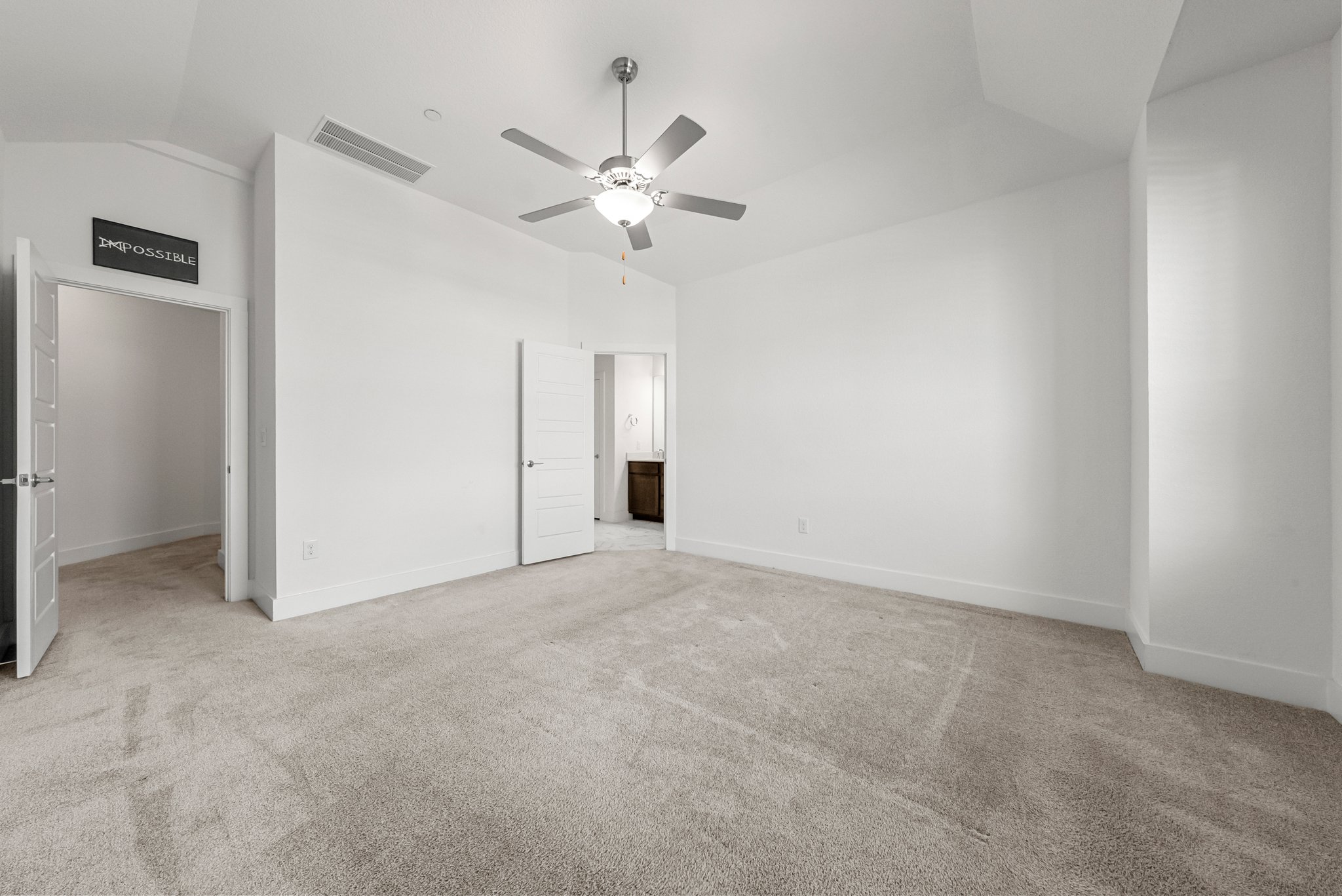 12315 Maypole Bend, Unit 1002 Austin, TX 78717 - Photo 10 of 29 Unfurnished bedroom featuring lofted ceiling, light colored carpet, and ceiling fan