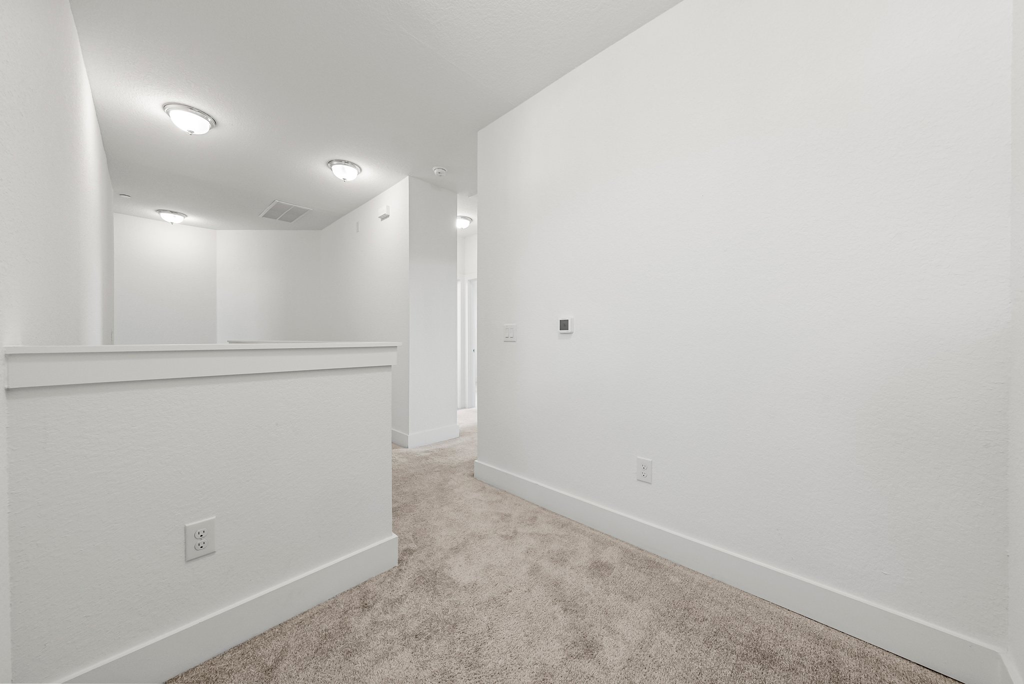 12315 Maypole Bend, Unit 1002 Austin, TX 78717 - Photo 15 of 29 Empty room featuring light carpet and baseboards