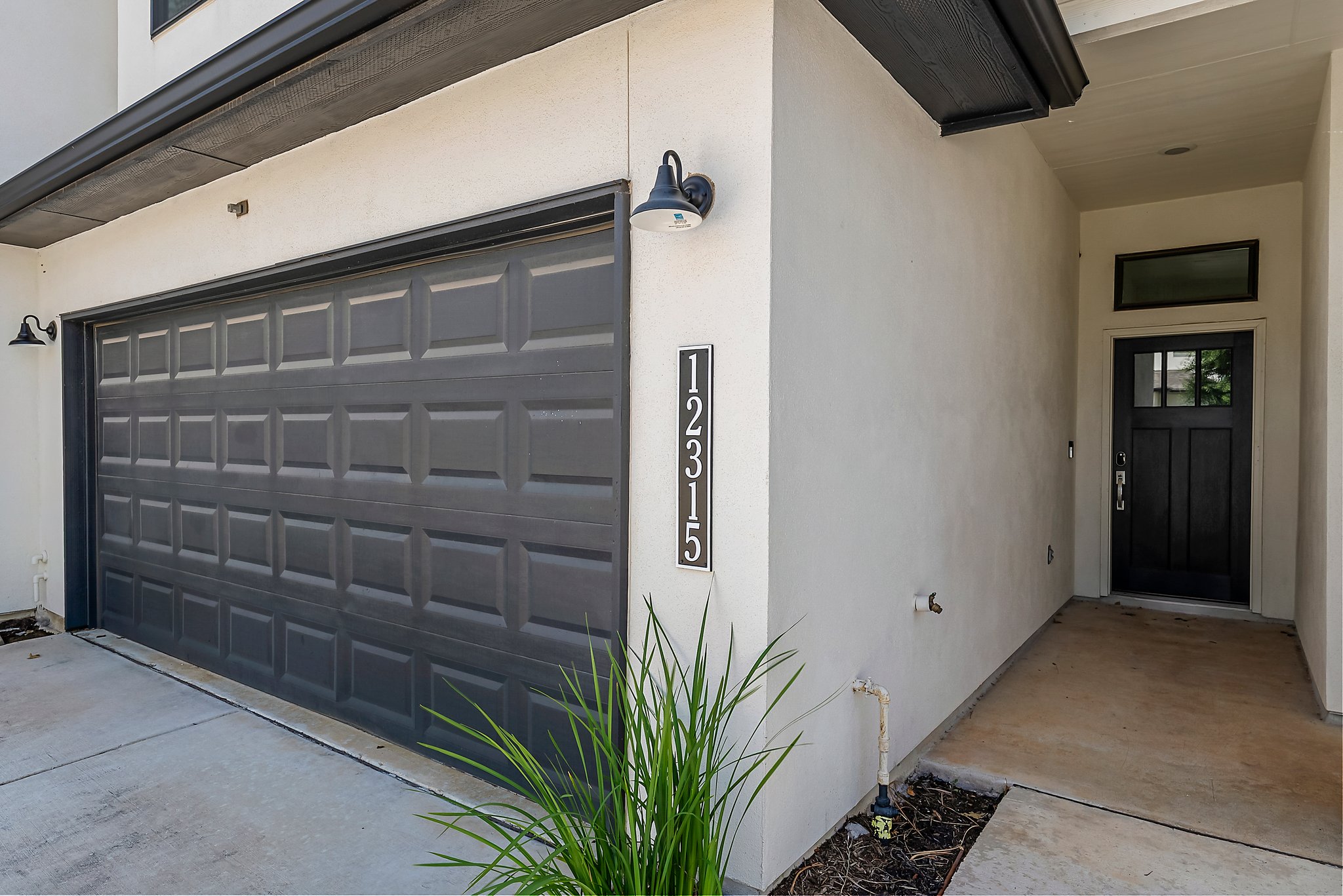 12315 Maypole Bend, Unit 1002 Austin, TX 78717 - Photo 2 of 29 Doorway to property featuring stucco siding and driveway