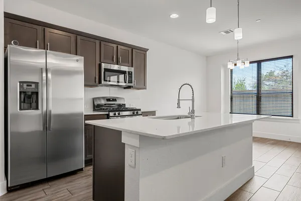 a view of kitchen with cabinets and wooden floor