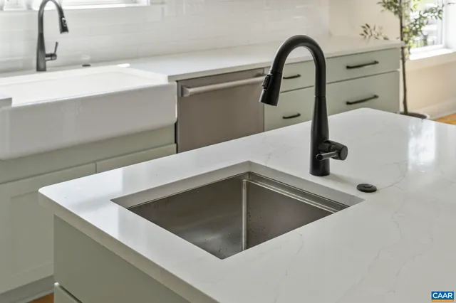 a close view of a stove a microwave and cabinets in the kitchen