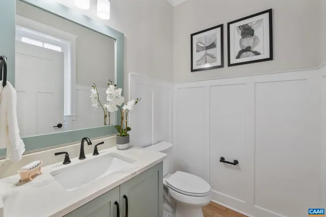 a bathroom with a double vanity sink mirror and double