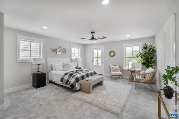 a front view of a house with a garden and yard