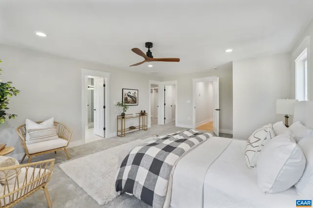 a balcony with wooden floor table and chairs
