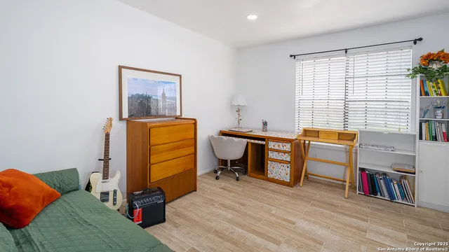 a room with furniture and a wooden floor