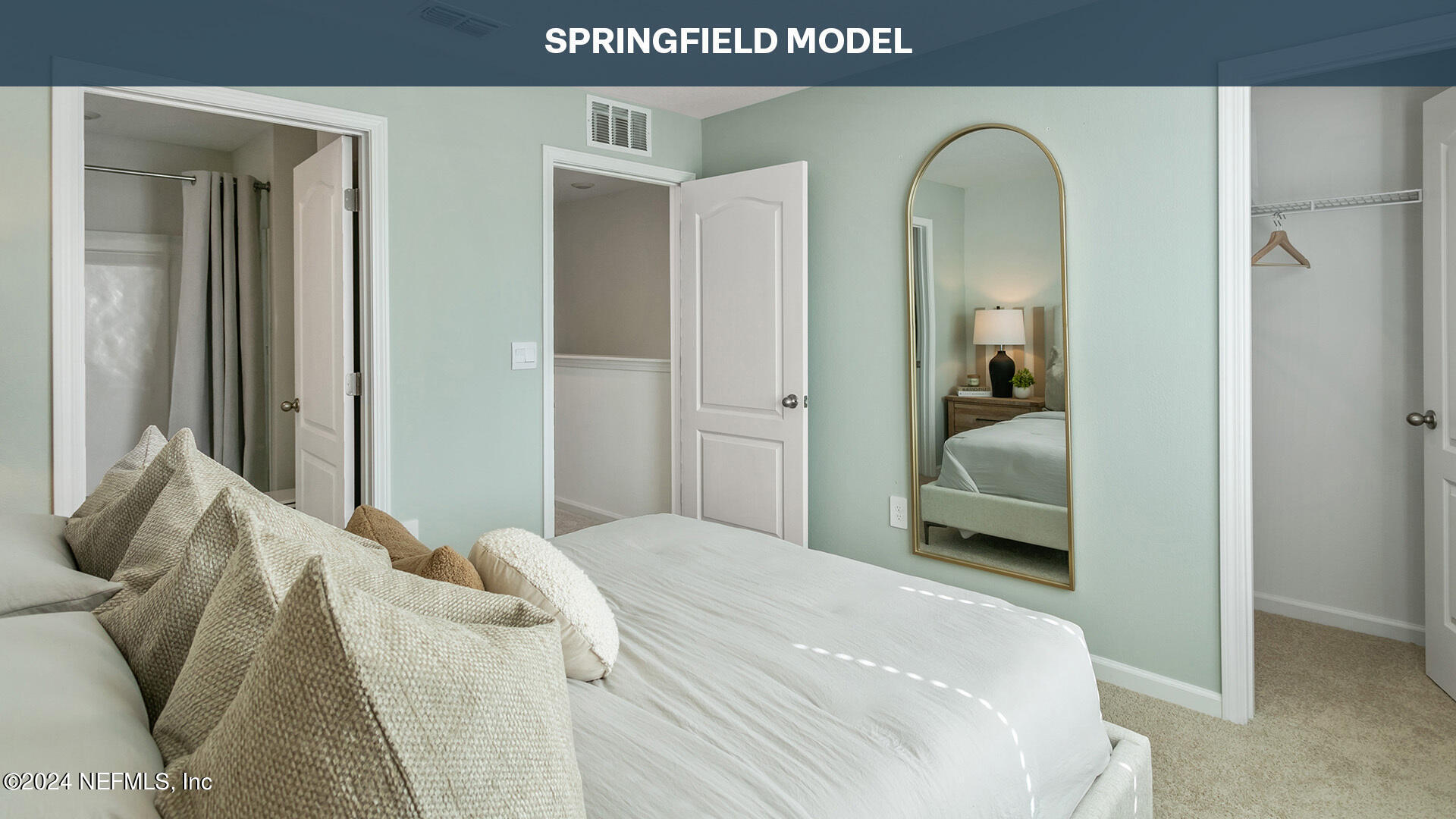 57 Montellano Road St. Augustine, FL 32084 - Photo 15 of 37 a bedroom with a bed and a mirror