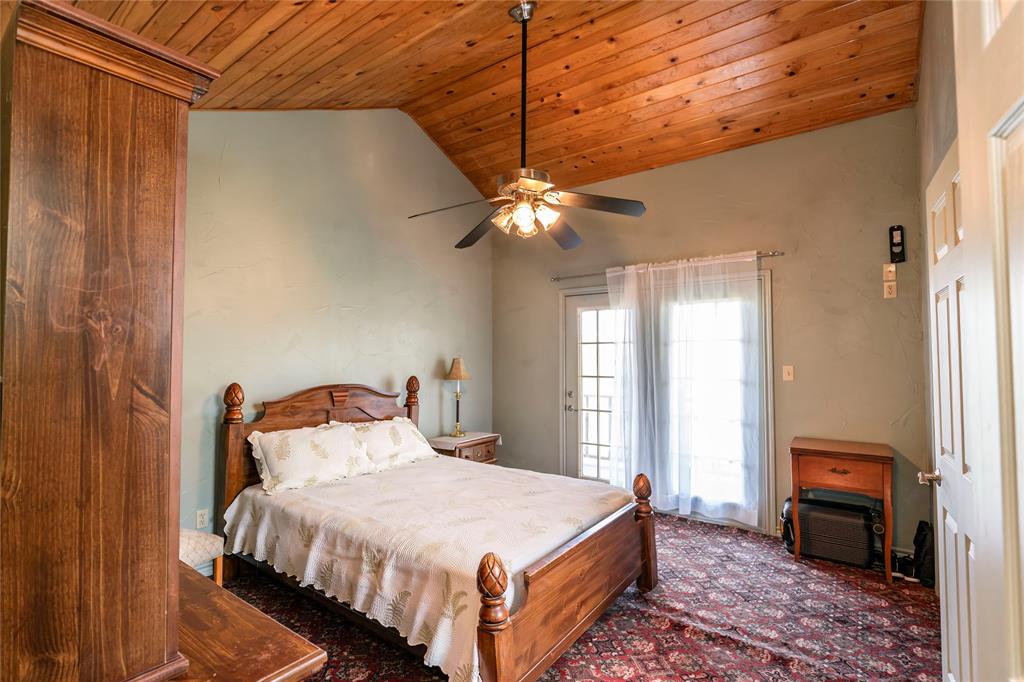 698 Storey Road Nocona, TX 76255 - Photo 28 of 34 a bedroom with a bed dresser and a window