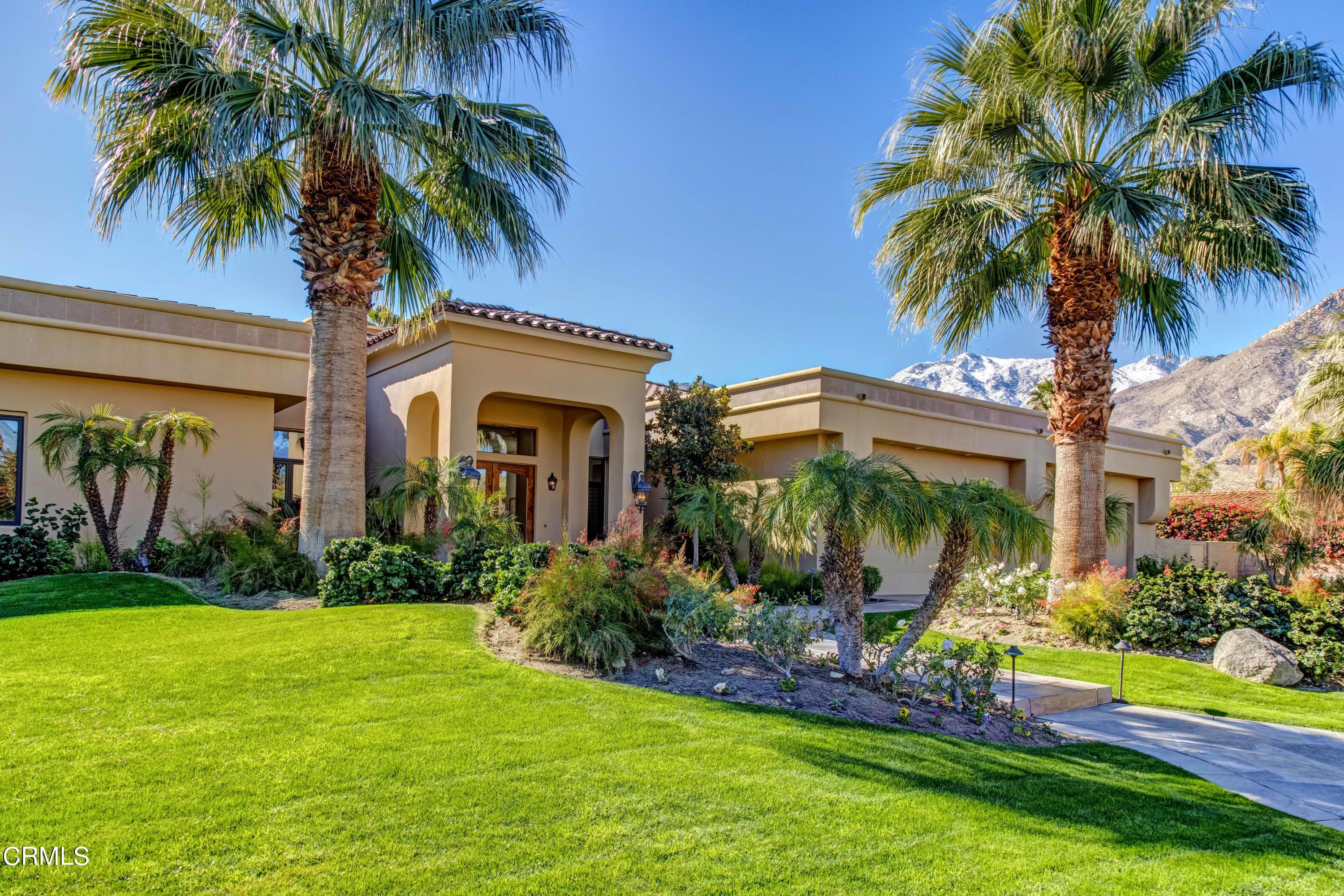 64435 Via Risso Palm Springs, CA 92264 - Photo 2 of 65 a front view of house and yard with green space