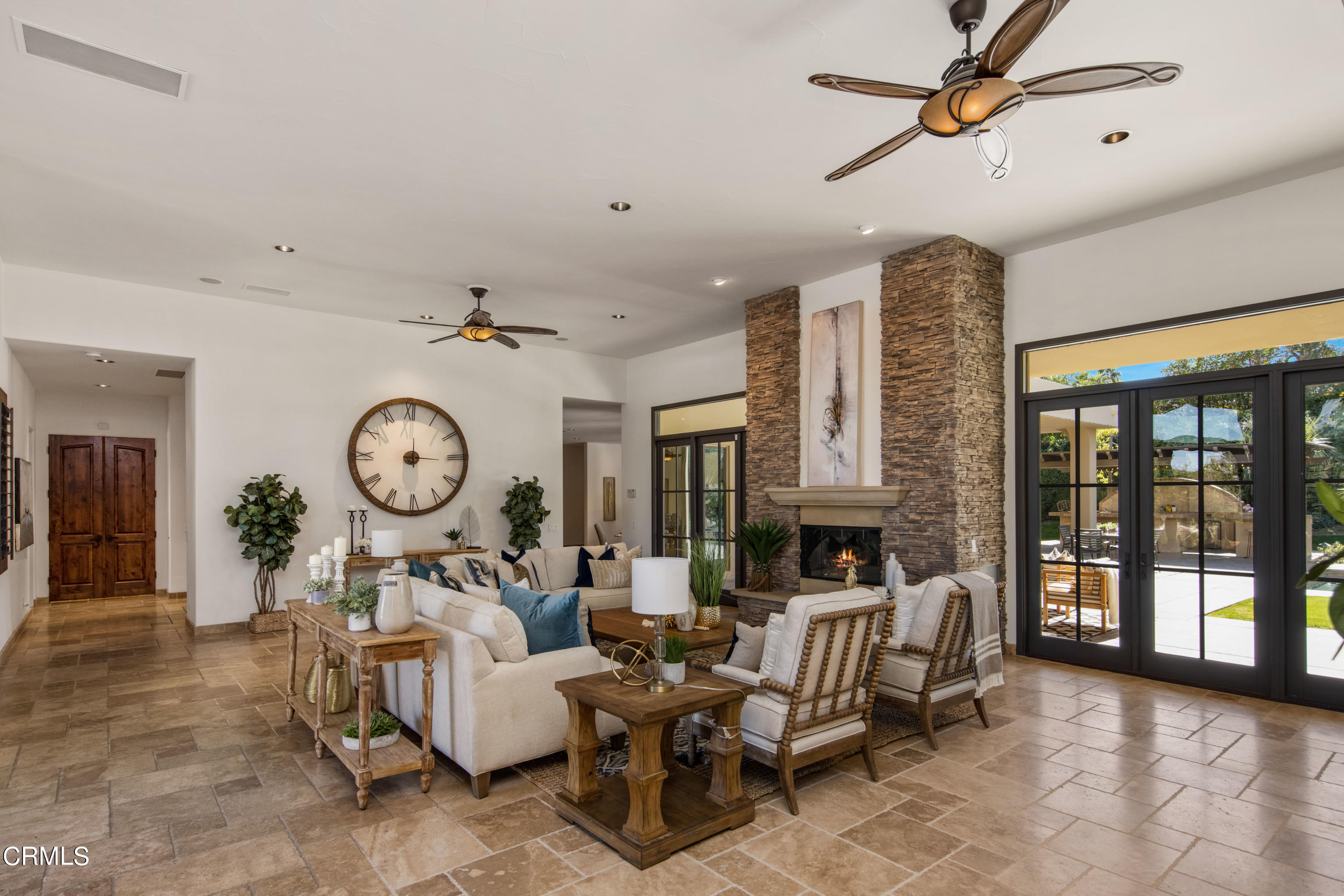 64435 Via Risso Palm Springs, CA 92264 - Photo 13 of 65 a living room with fireplace furniture and a large window