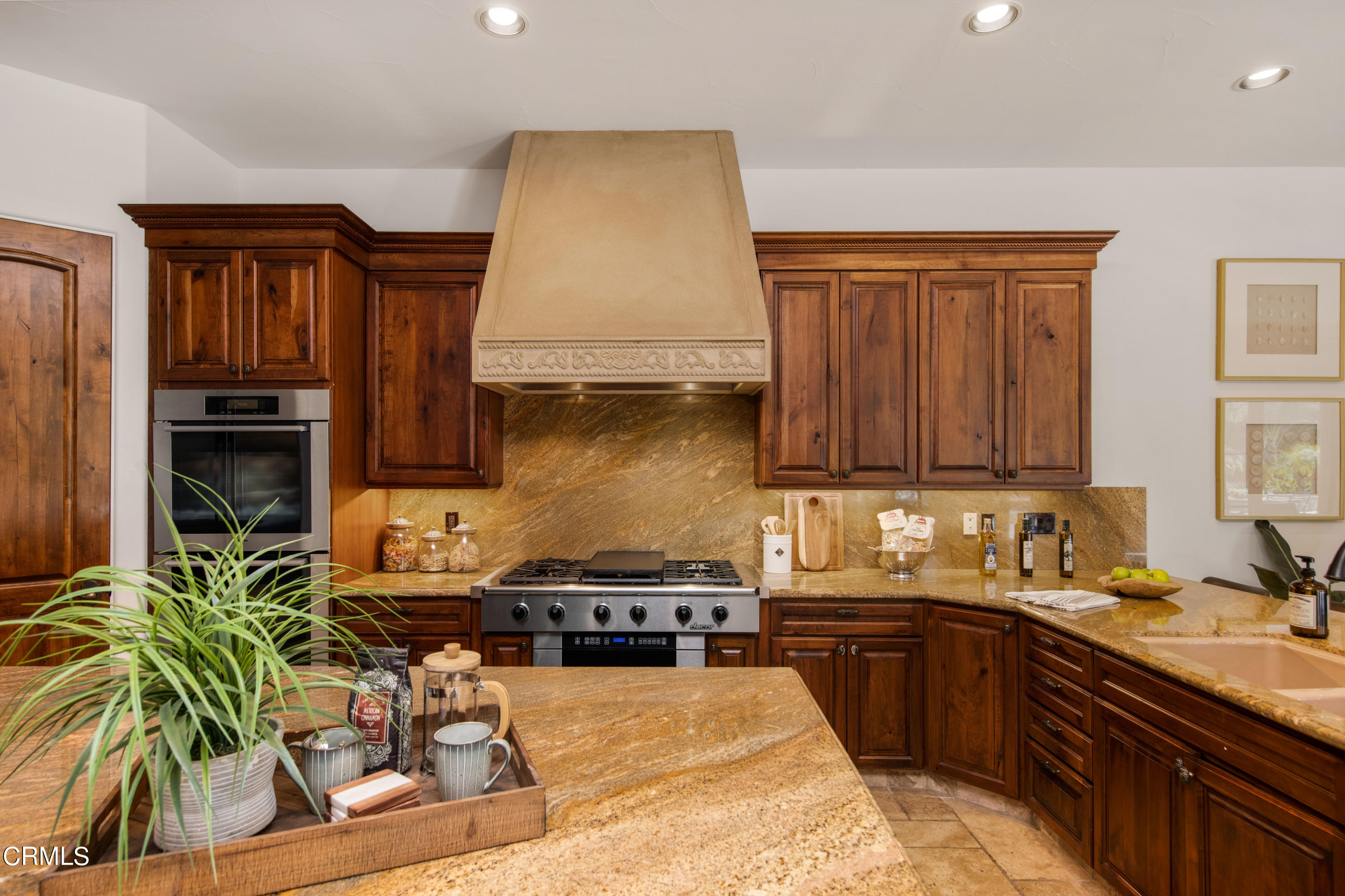 64435 Via Risso Palm Springs, CA 92264 - Photo 18 of 65 a kitchen with a sink a stove and cabinets