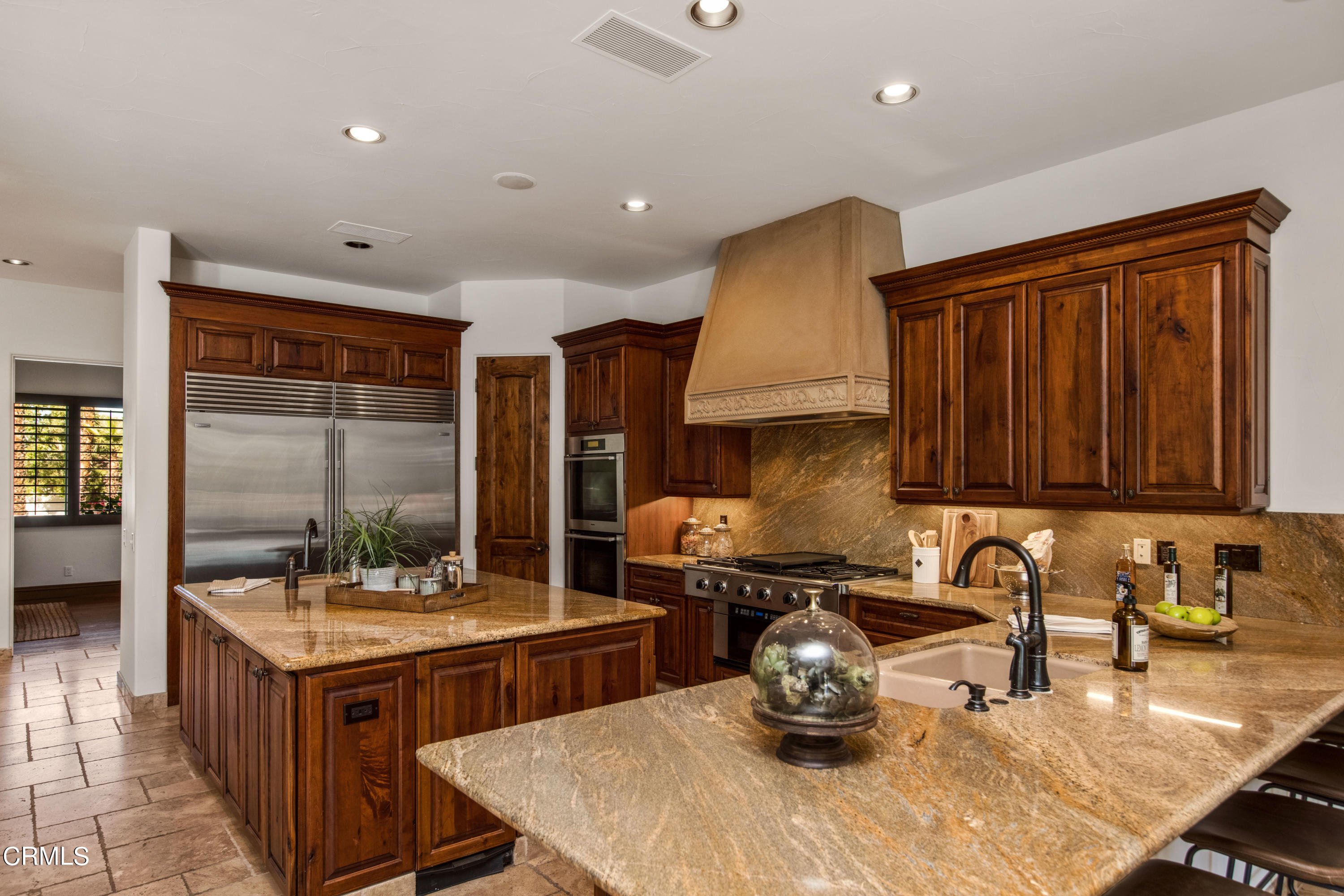 64435 Via Risso Palm Springs, CA 92264 - Photo 19 of 65 a kitchen with a stove a sink and a refrigerator