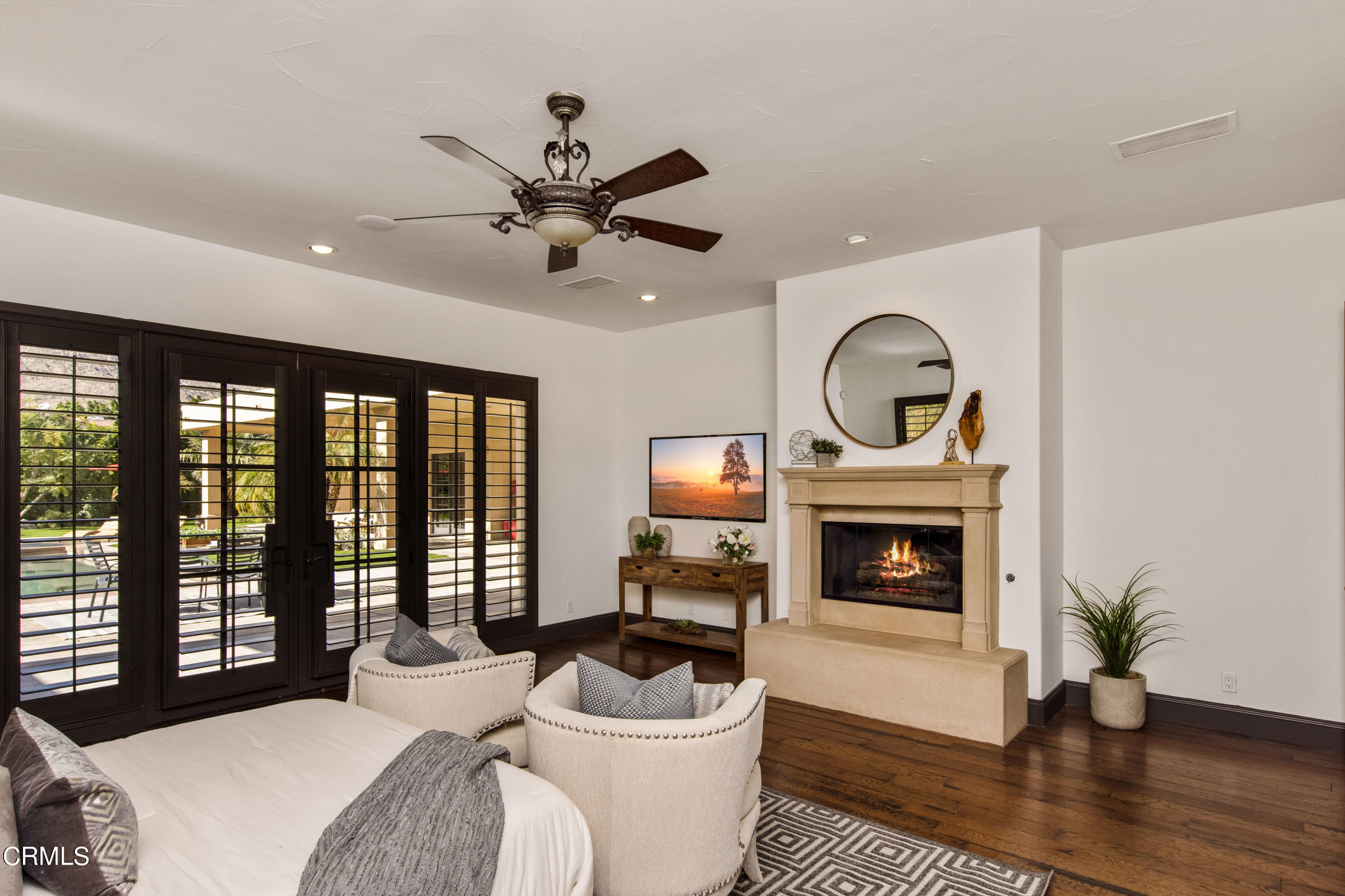 64435 Via Risso Palm Springs, CA 92264 - Photo 27 of 65 a living room with furniture a fireplace and a potted plant