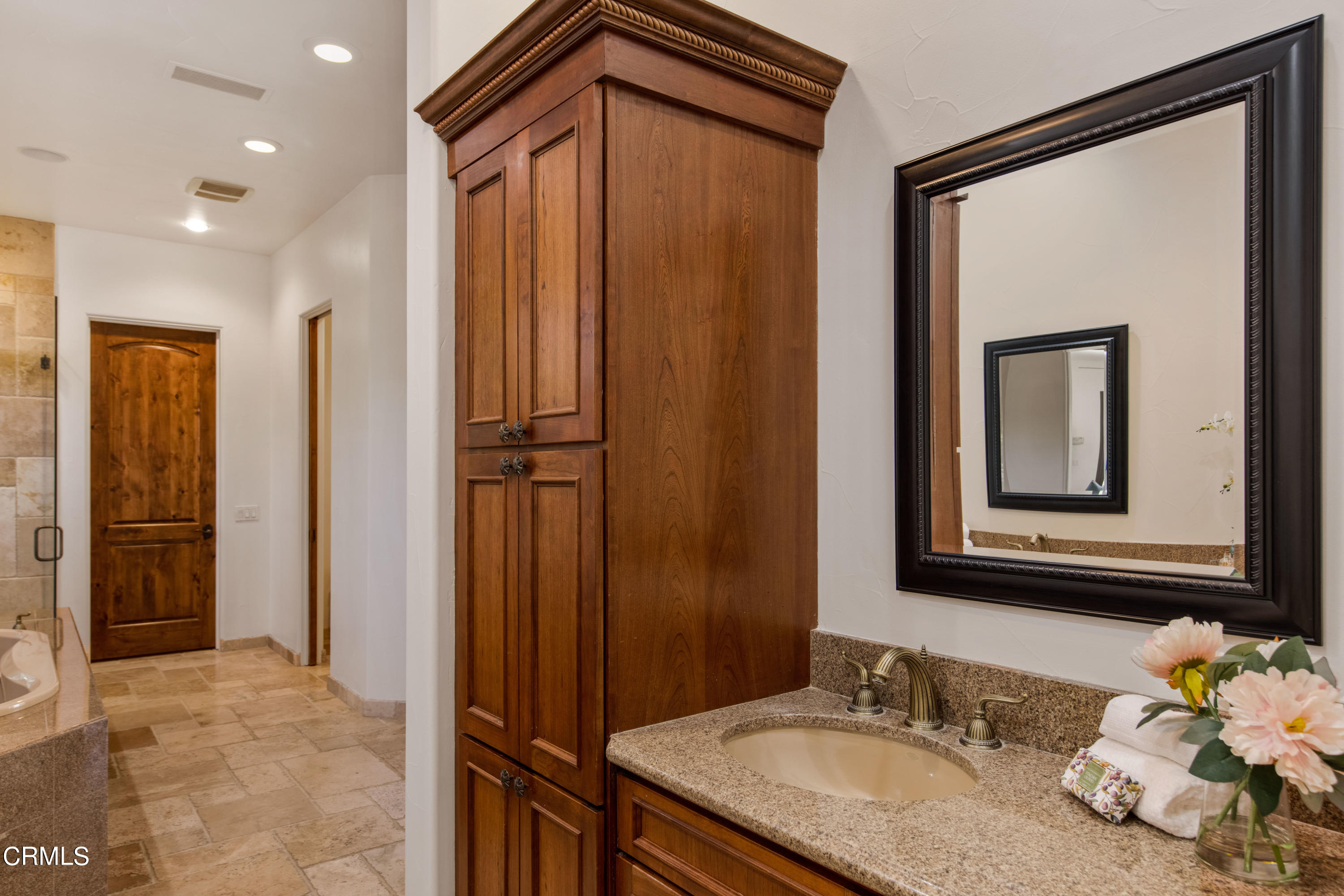 64435 Via Risso Palm Springs, CA 92264 - Photo 31 of 65 a bathroom with a granite countertop sink and a mirror