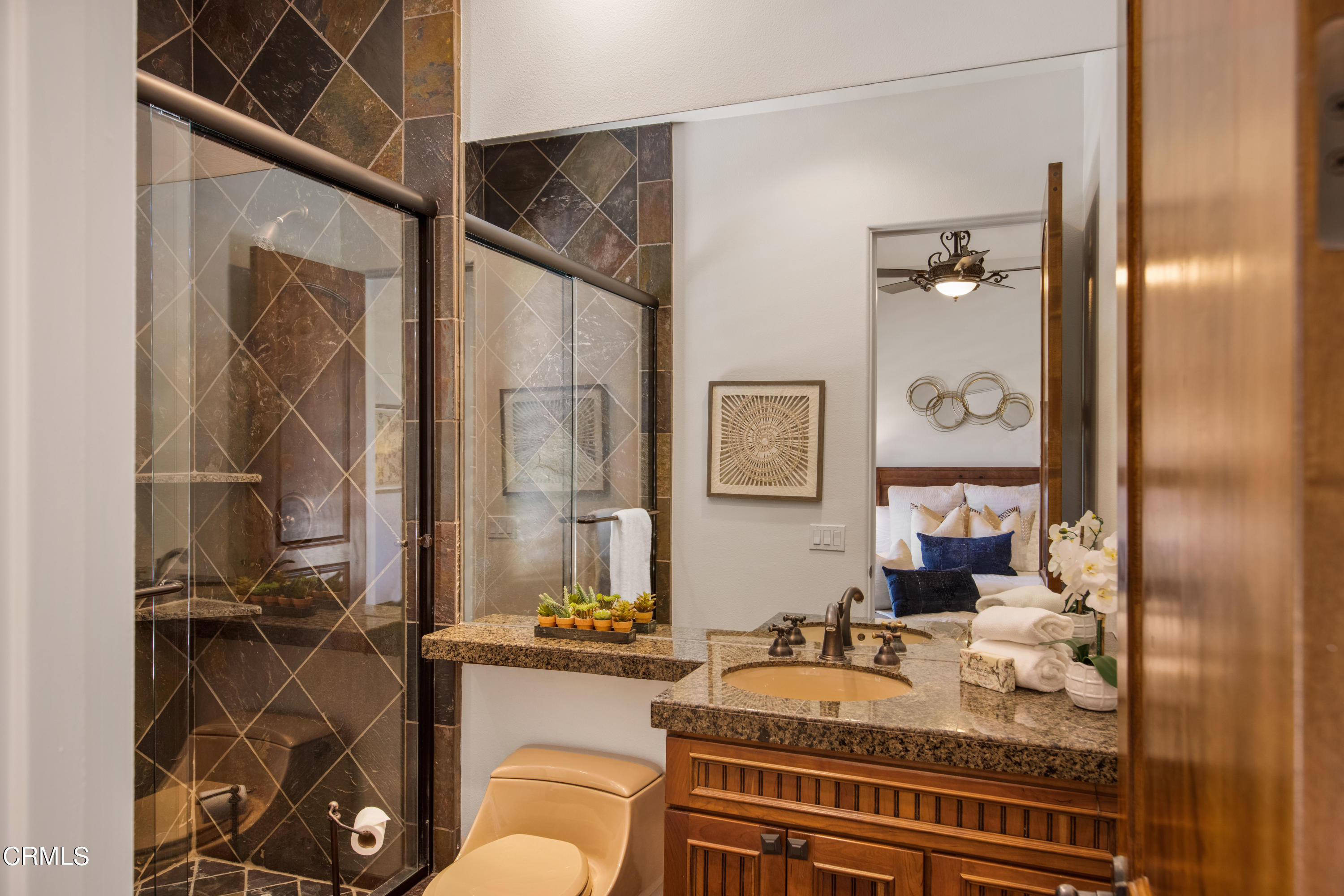 64435 Via Risso Palm Springs, CA 92264 - Photo 36 of 65 a bathroom with a granite countertop tub a sink and a mirror