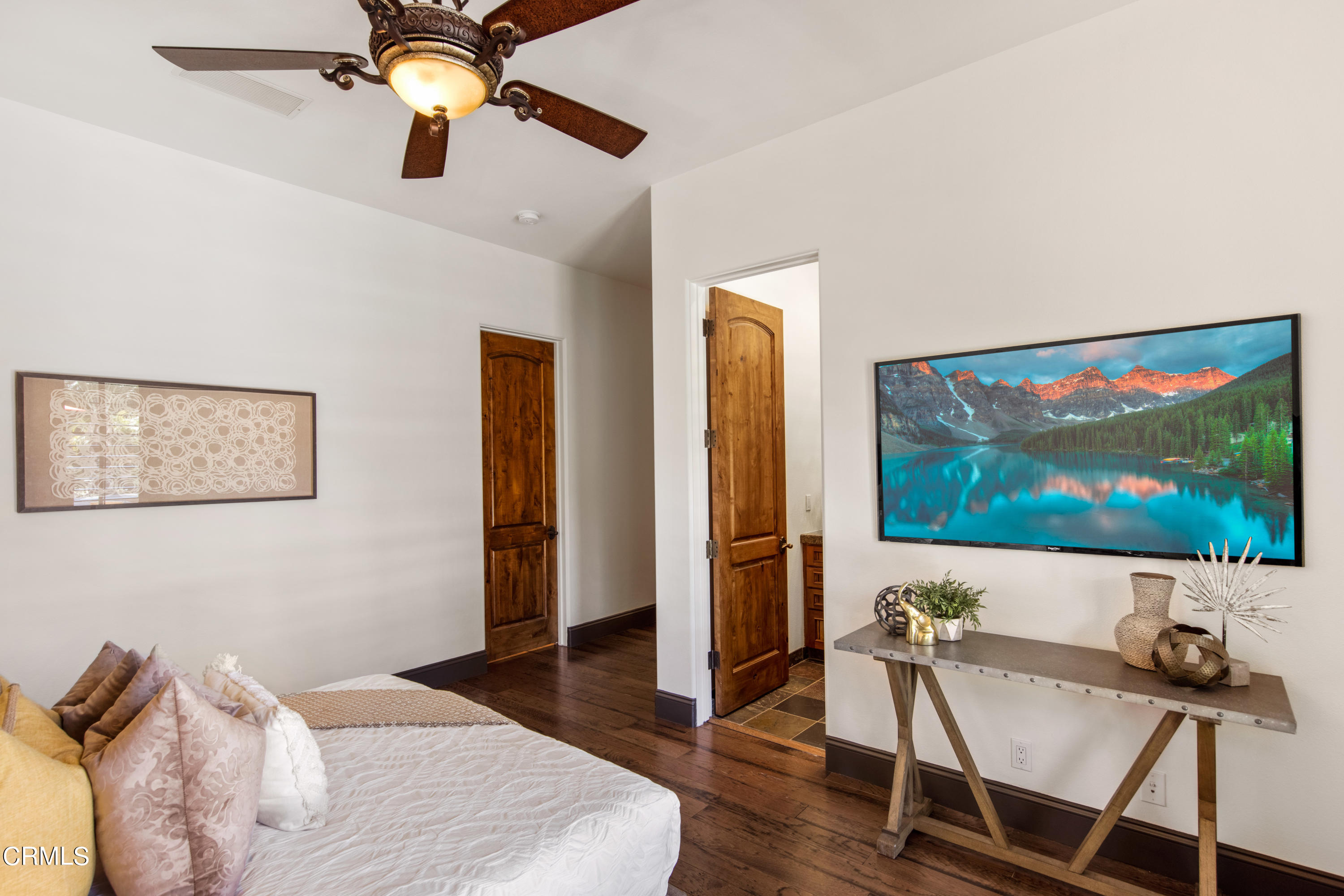 64435 Via Risso Palm Springs, CA 92264 - Photo 37 of 65 a bedroom with furniture and a painting on the wall