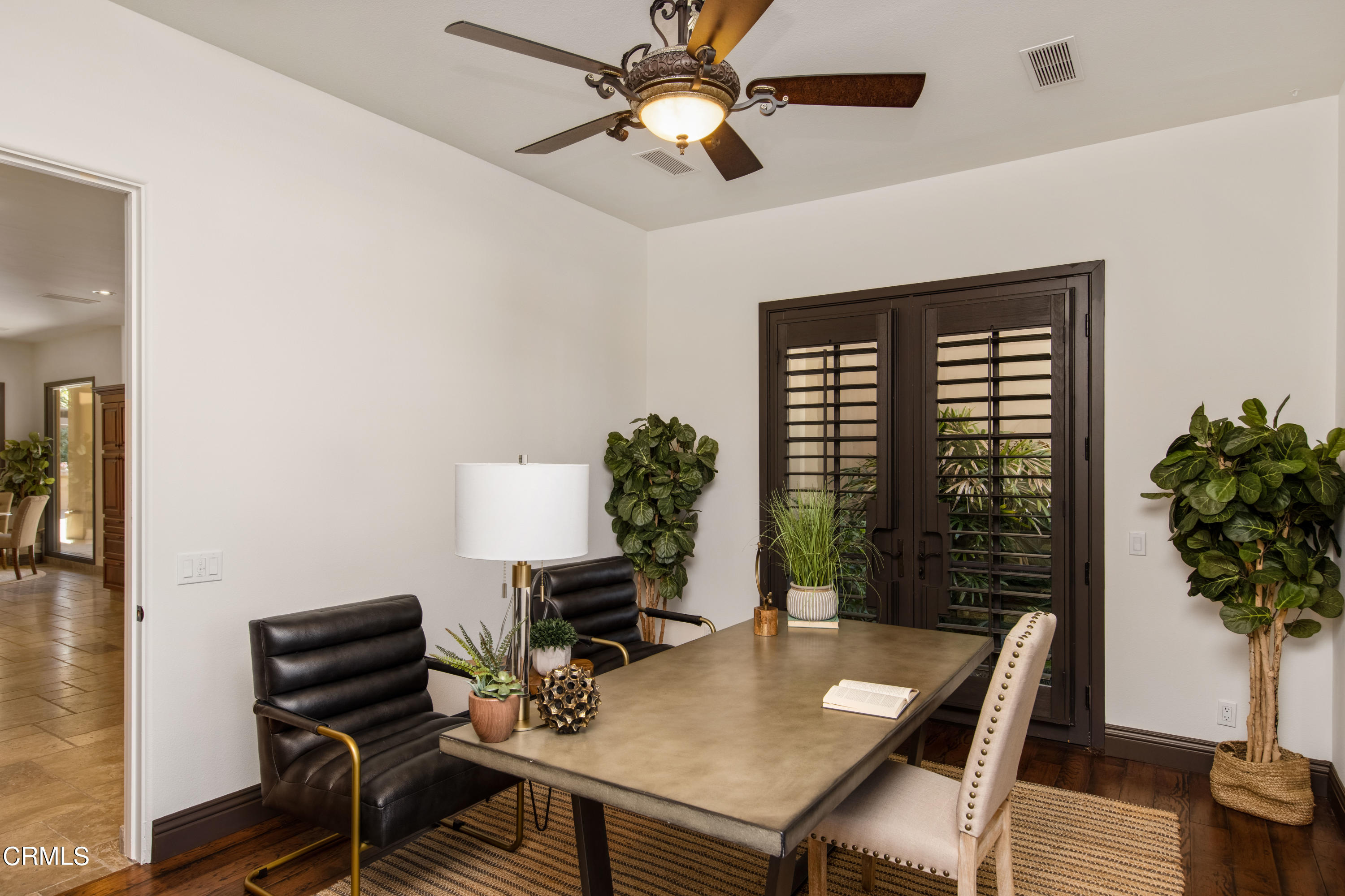 64435 Via Risso Palm Springs, CA 92264 - Photo 41 of 65 a view of a workspace with furniture and a potted plant