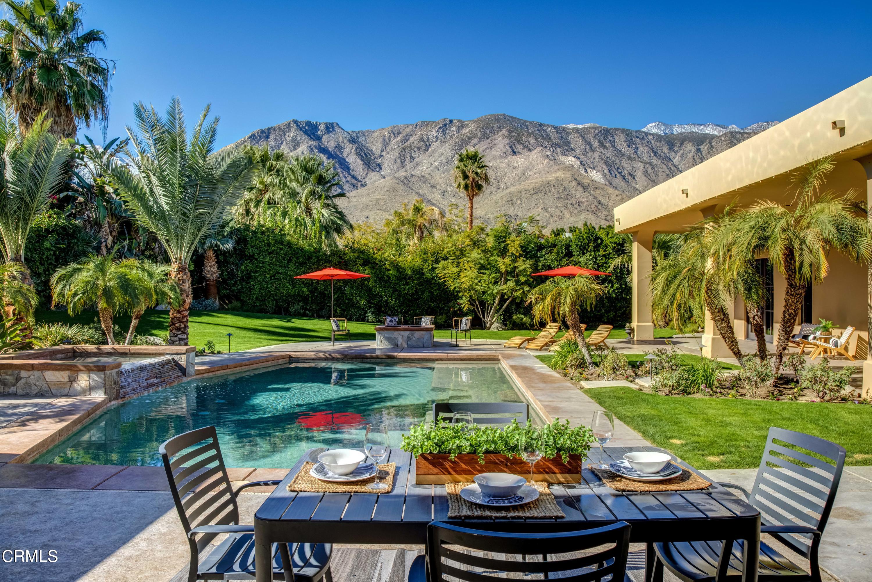 64435 Via Risso Palm Springs, CA 92264 - Photo 47 of 65 a view of yard with swimming pool and green yard
