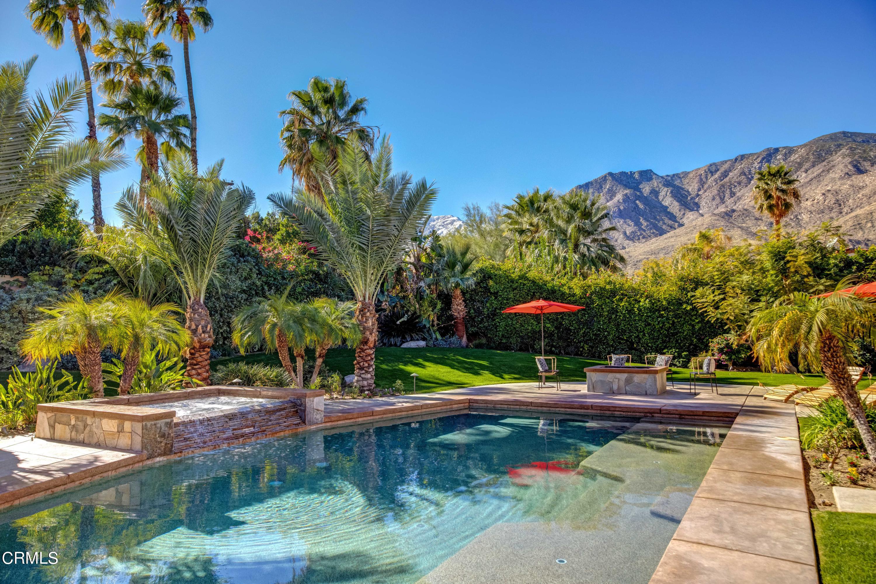 64435 Via Risso Palm Springs, CA 92264 - Photo 49 of 65 a view of a swimming pool with an outdoor seating